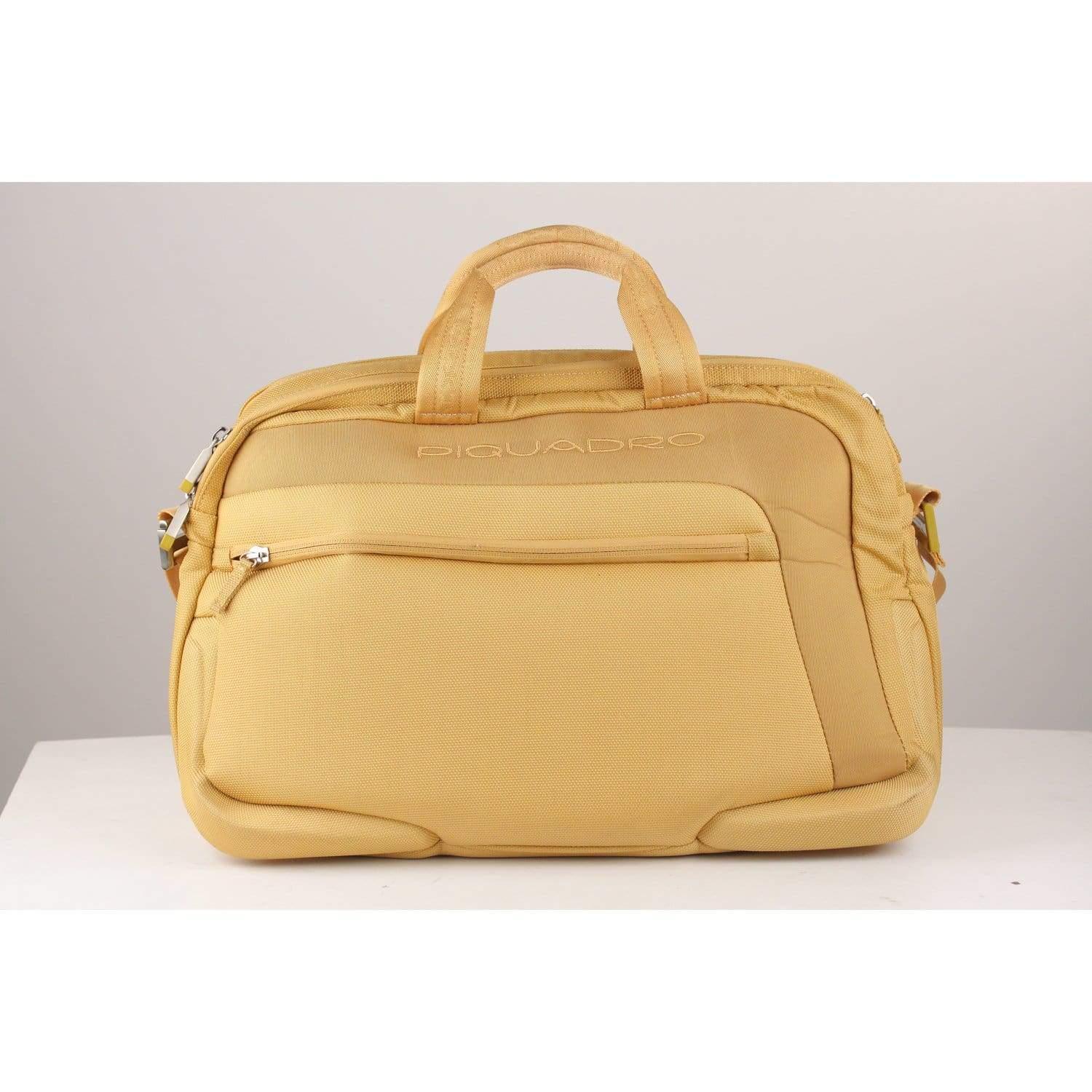 MATERIAL: Canvas COLOR: Yellow MODEL: Briefcase GENDER: Women, Men SIZE: Large Condition CONDITION DETAILS: B :GOOD CONDITION - Some light wear of use - some darkness on bottom corners Measurements MEASUREMENTS: BAG HEIGHT: 11.5 inches - 29,2 cm BAG