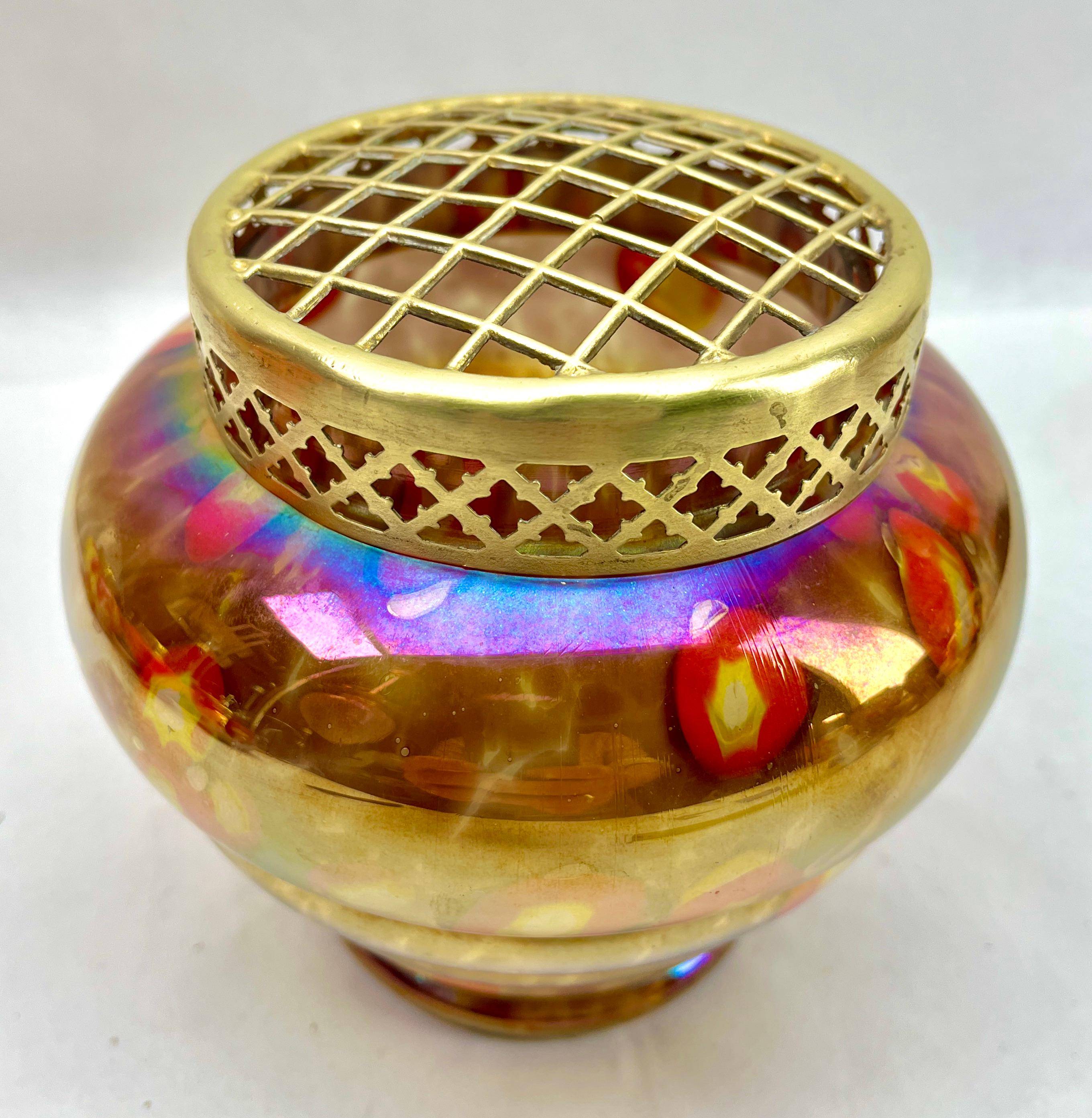 Dramatic multi color decor, in hand blown splatter glass vase . This design for vases is often called 'Pique fleurs' or 'rose-bowl' and is supplied with a fitted metal grille to support stems in an arrangement. 

Special color and technique for any