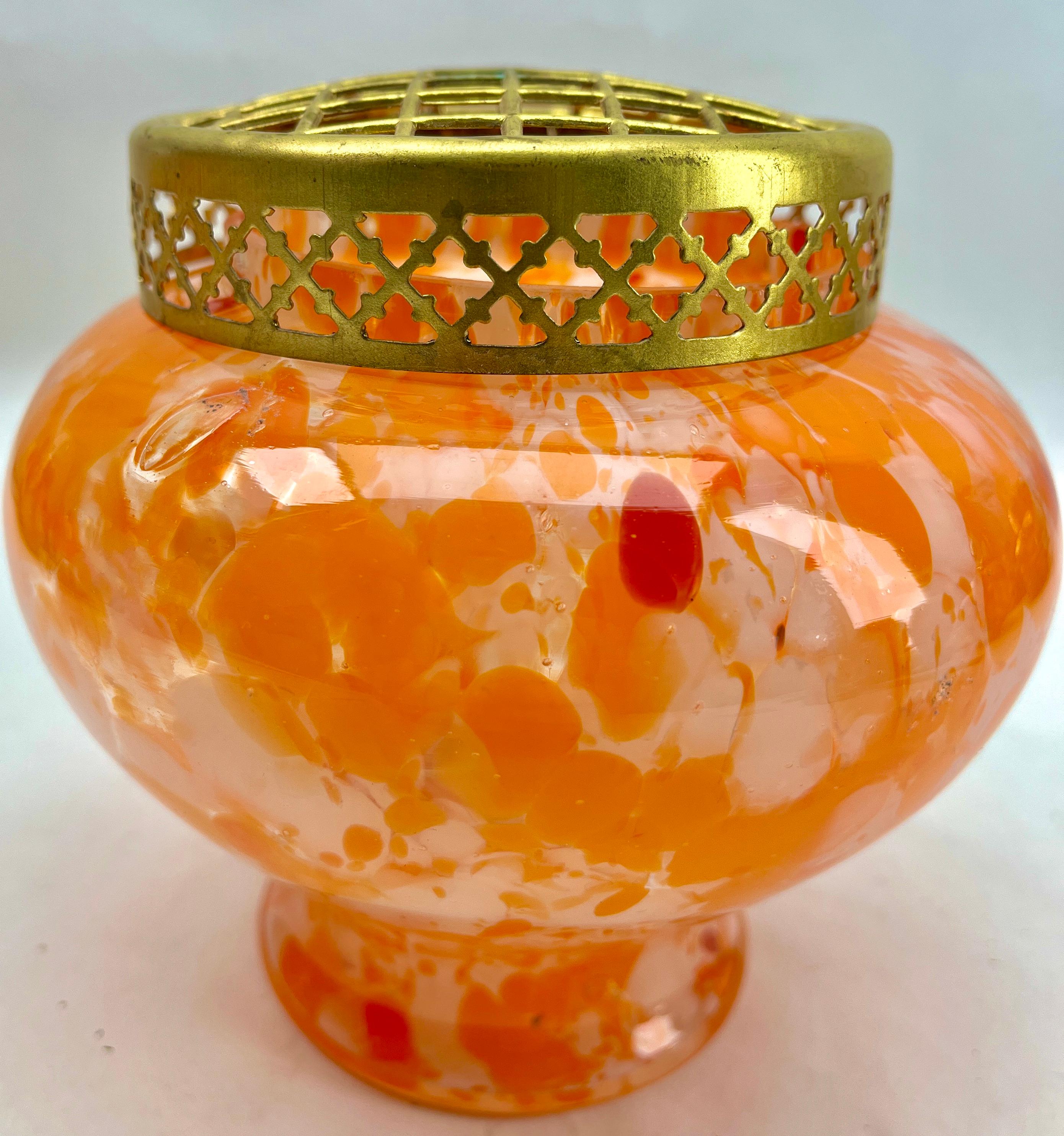 Dramatic multi color decor, cobalt and orange, in hand blown splatter glass vase in the Art Deco style. This design for vases is often called 'Pique fleurs' or 'rose-bowl' and is supplied with a fitted metal grille to support stems in an