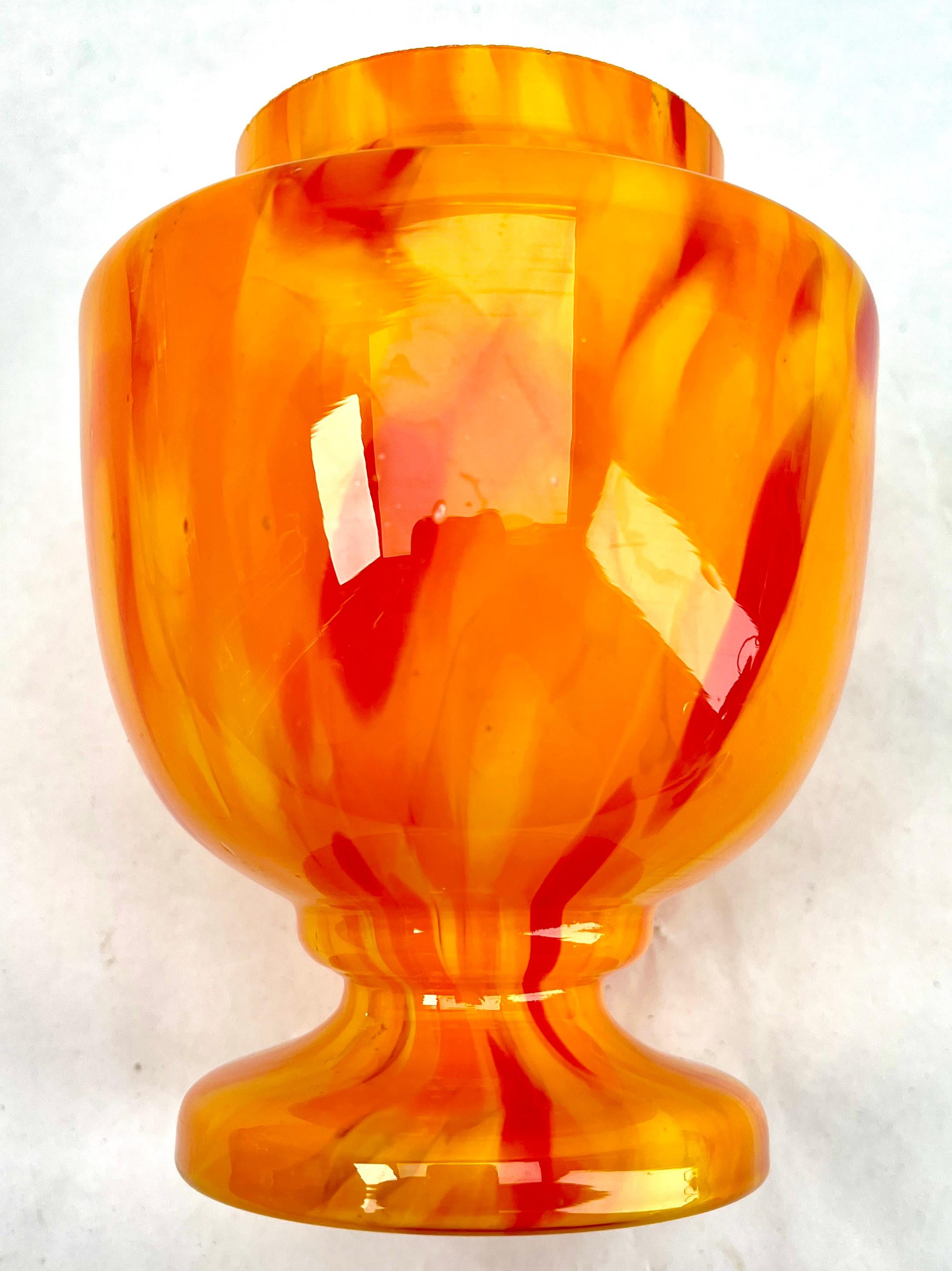 Dramatic multi color decor, cobalt and orange, in hand blown splatter glass vase in the Art Deco style. This design for vases is often called 'Pique fleurs' or 'rose-bowl' and is supplied with a fitted metal grille to support stems in an