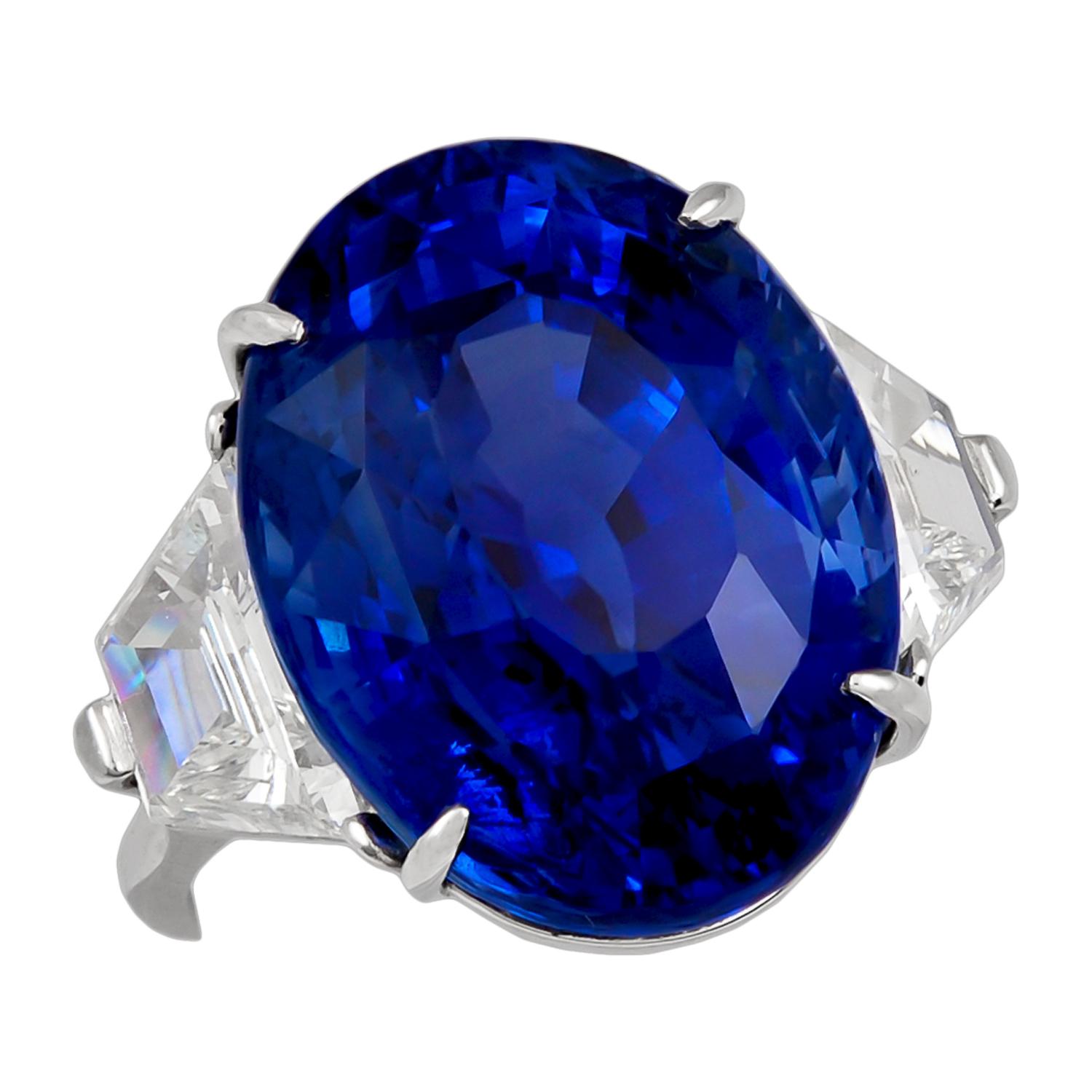 The oval-shaped ceylon sapphire weighing 29.83 carats, flanked by two trapeze diamonds weighing approximately 2.00 carats, size 5¾, signed Piranesi. 
Sapphire comes with GIA certificate.
Condition: Good - Previously owned and gently worn, with