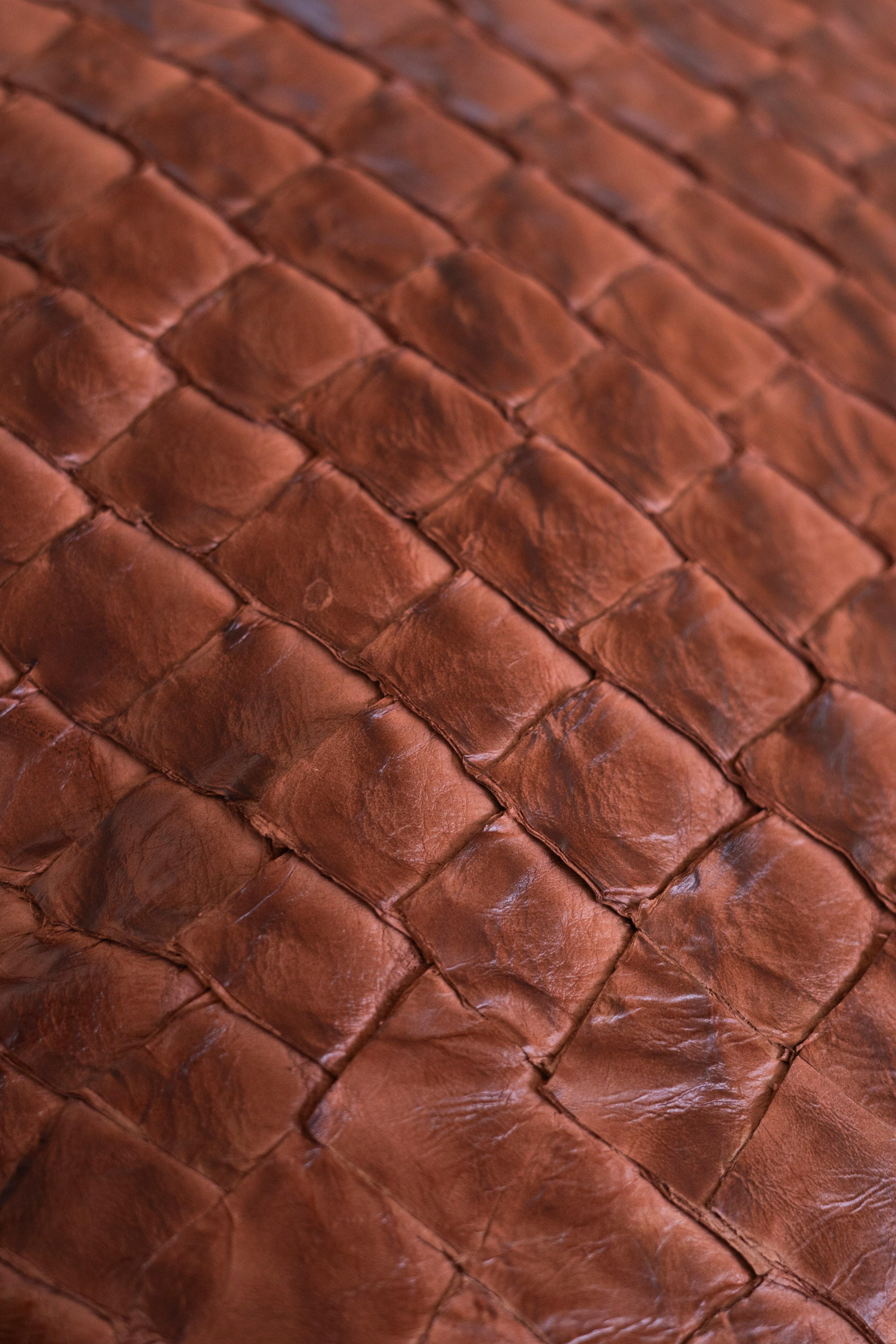 Pirarucu leather brings new life to one of the Amazon’s most emblematic fish. Traditionally valued for its meat, the pirarucu’s skin was often discarded. Today, it is transformed into a distinctive, durable leather that preserves the natural texture