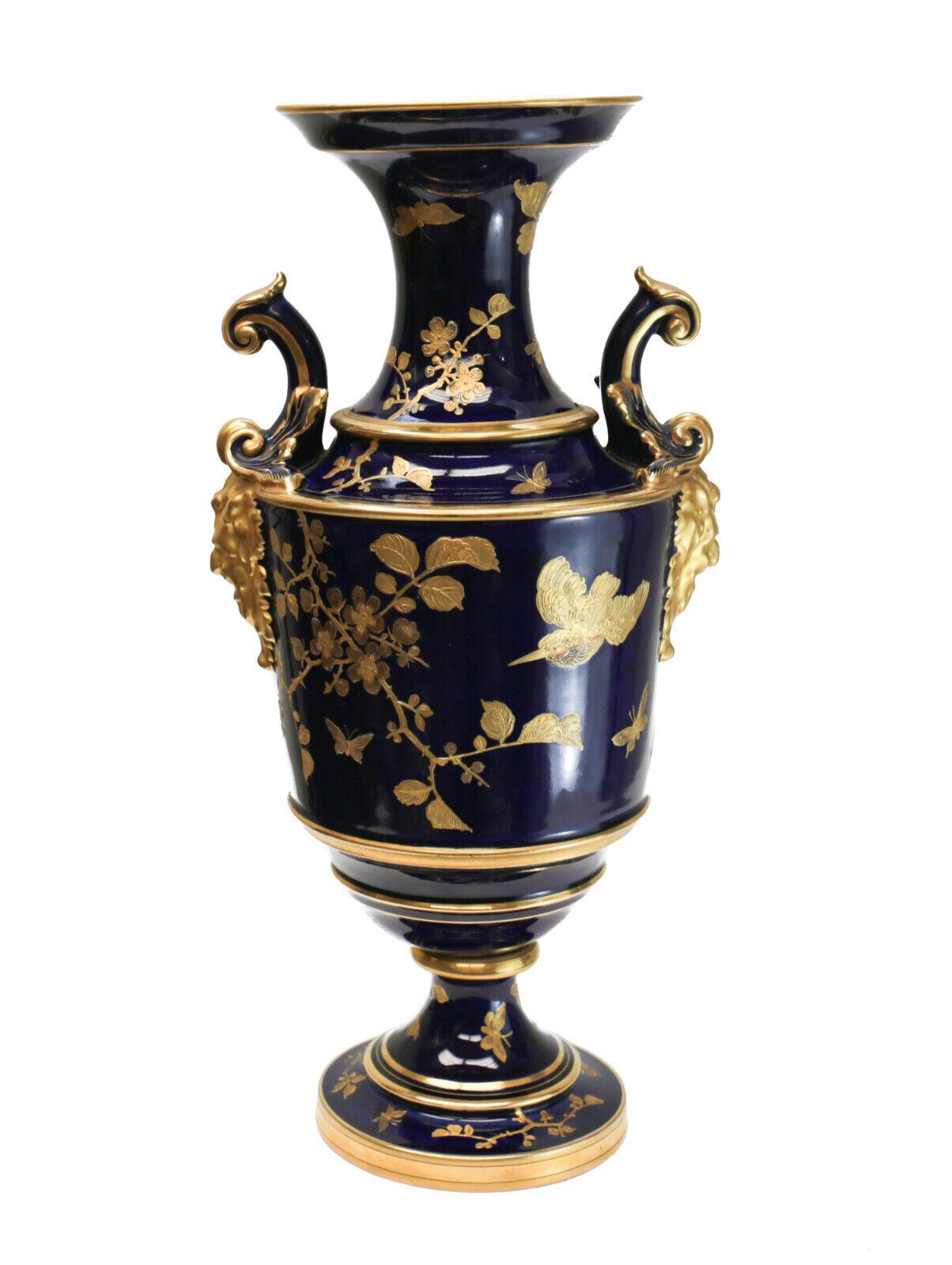 Pirkenhammer cobalt blue porcelain and gilt double handled footed vase, circa 1900

Beautiful gilt encrusted birds and florals throughout. Figural male heads to the sides of the handles. Pirkenhammer mark to the underside. 

Additional
