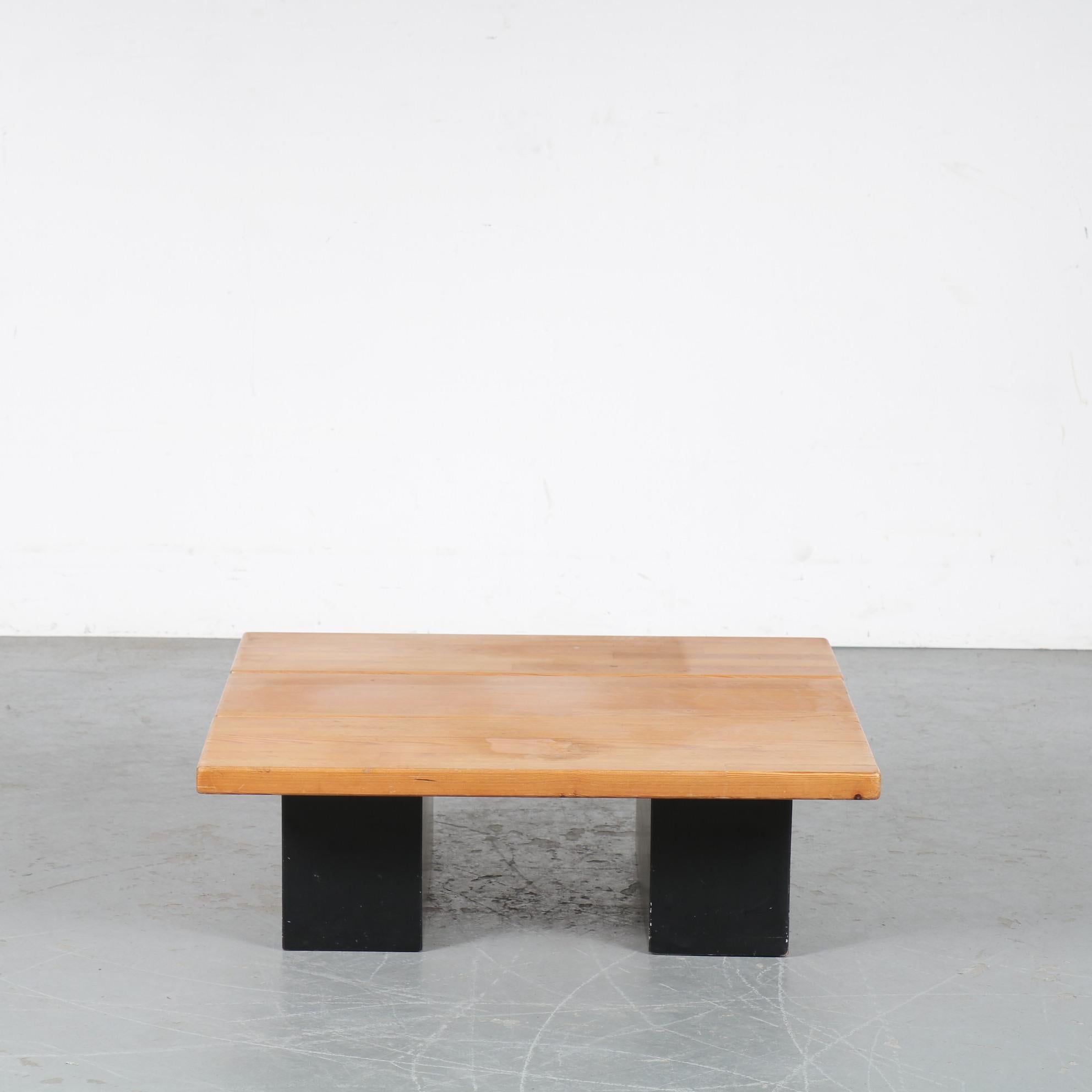 This is an eye-catching wooden coffee table designed by Ilmari Tapiovaara, manufactured by Laukaan Puu in Finland around 1950.

It is made of two different tones of wood. The base is a deep black lacuqered wood, while the pine wooden square top of