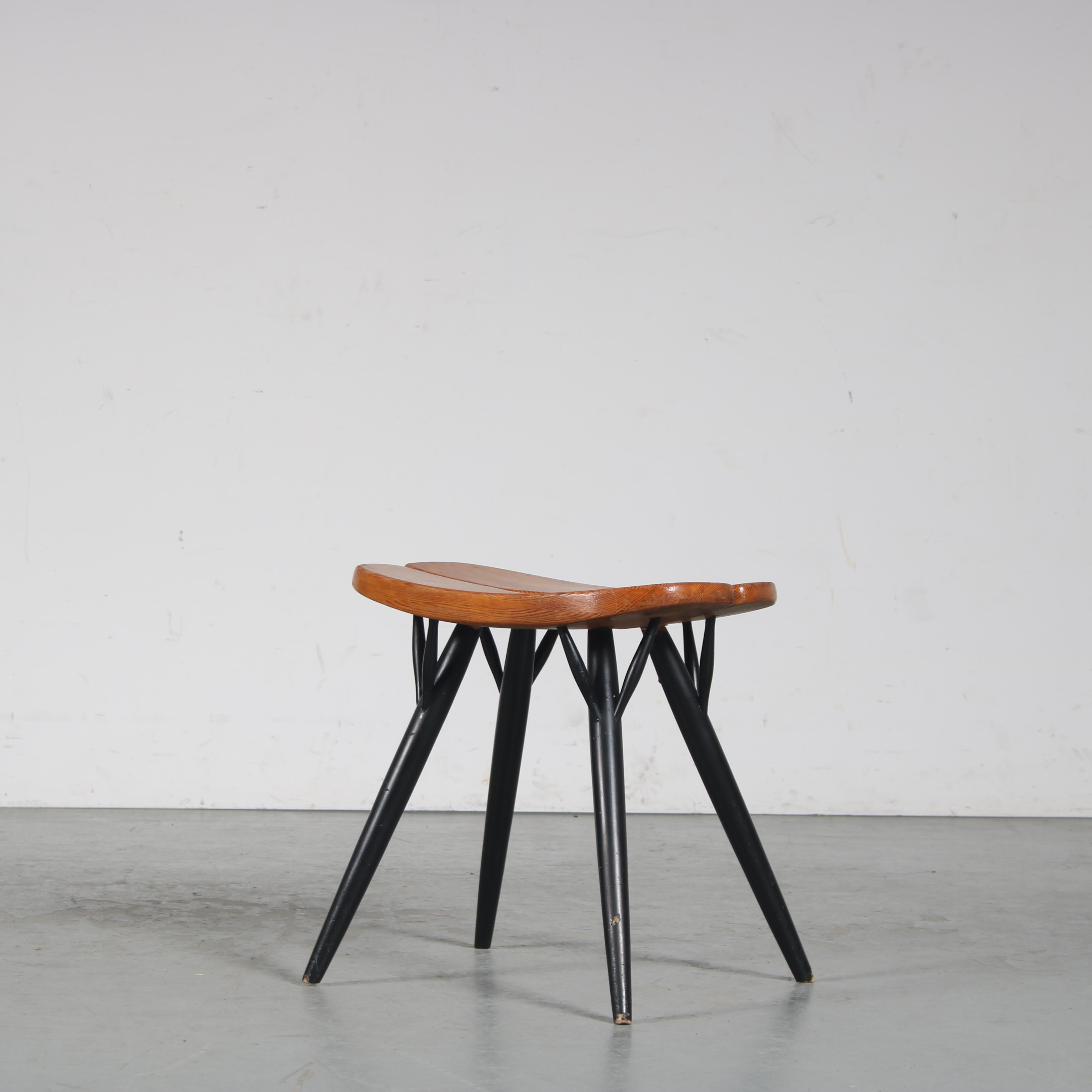 An eye-catching “Pirkka” stool designed by Ilmari Tapiovaara, manufactured by Laukaan Puu in FInland around 1950.

This lovely design is made of pine wood with black lacquered wooden legs. The tapered legs and curved seat give it a nice style, the