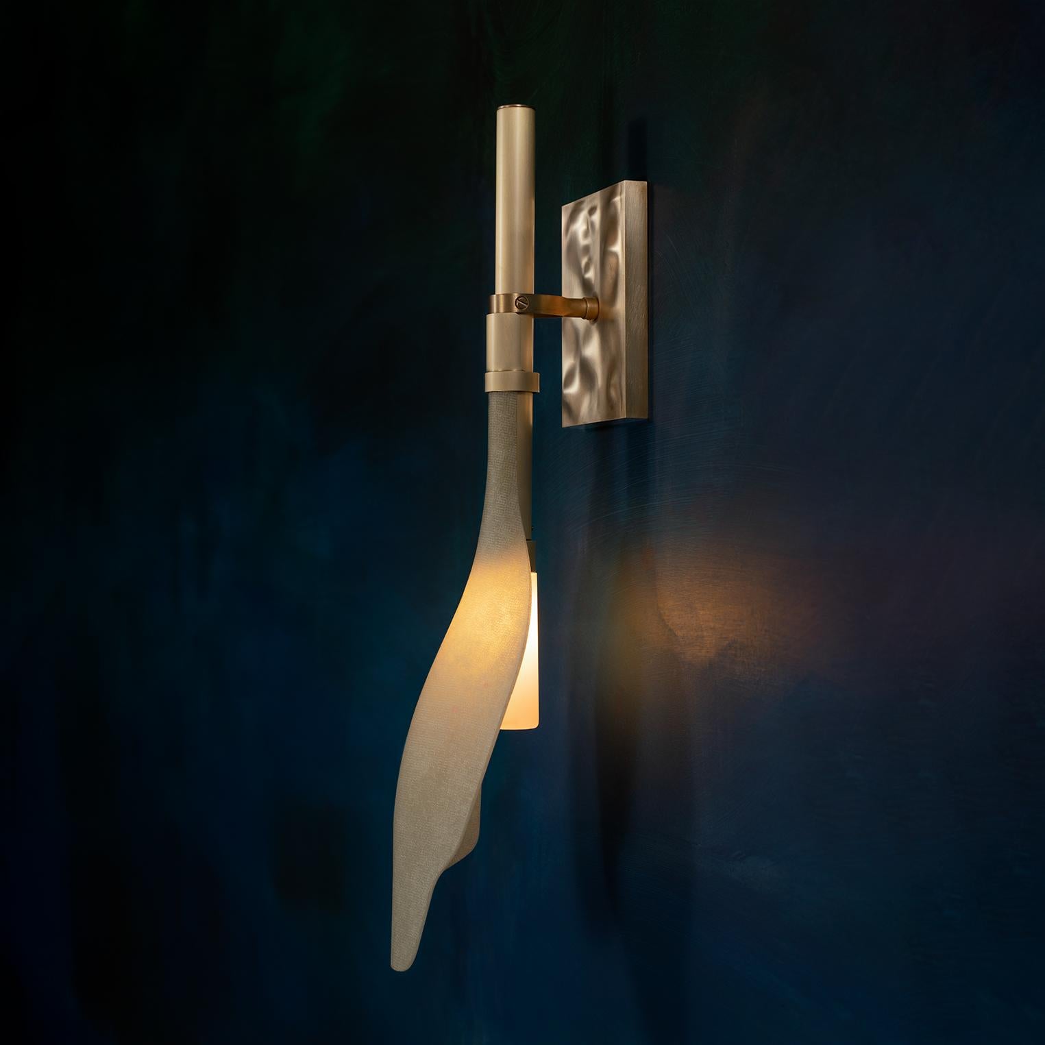 The Malcolm sconce is part of Andrea Claire’s Pisces collection, which is inspired by the mesmerizing movement of glowing kelp blades in sunlit waters. 

This carefully crafted piece illuminates and draws us into memories of the beach and rhythms