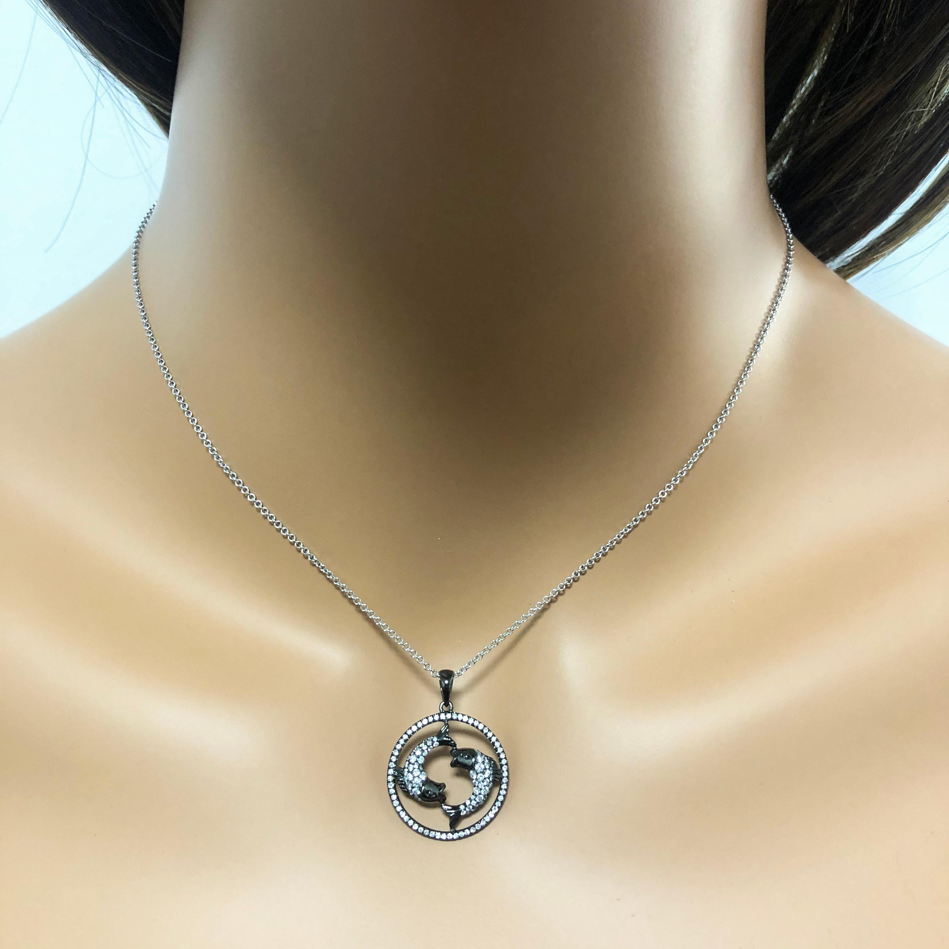 An elegant Pisces zodiac necklace set with sparkling round diamonds weighing 0.52 carats total.  Made with 18k gold, plated with black rhodium. Comes with 16 inch white gold chain. This is a perfect birthday gift for people who celebrate birthdays