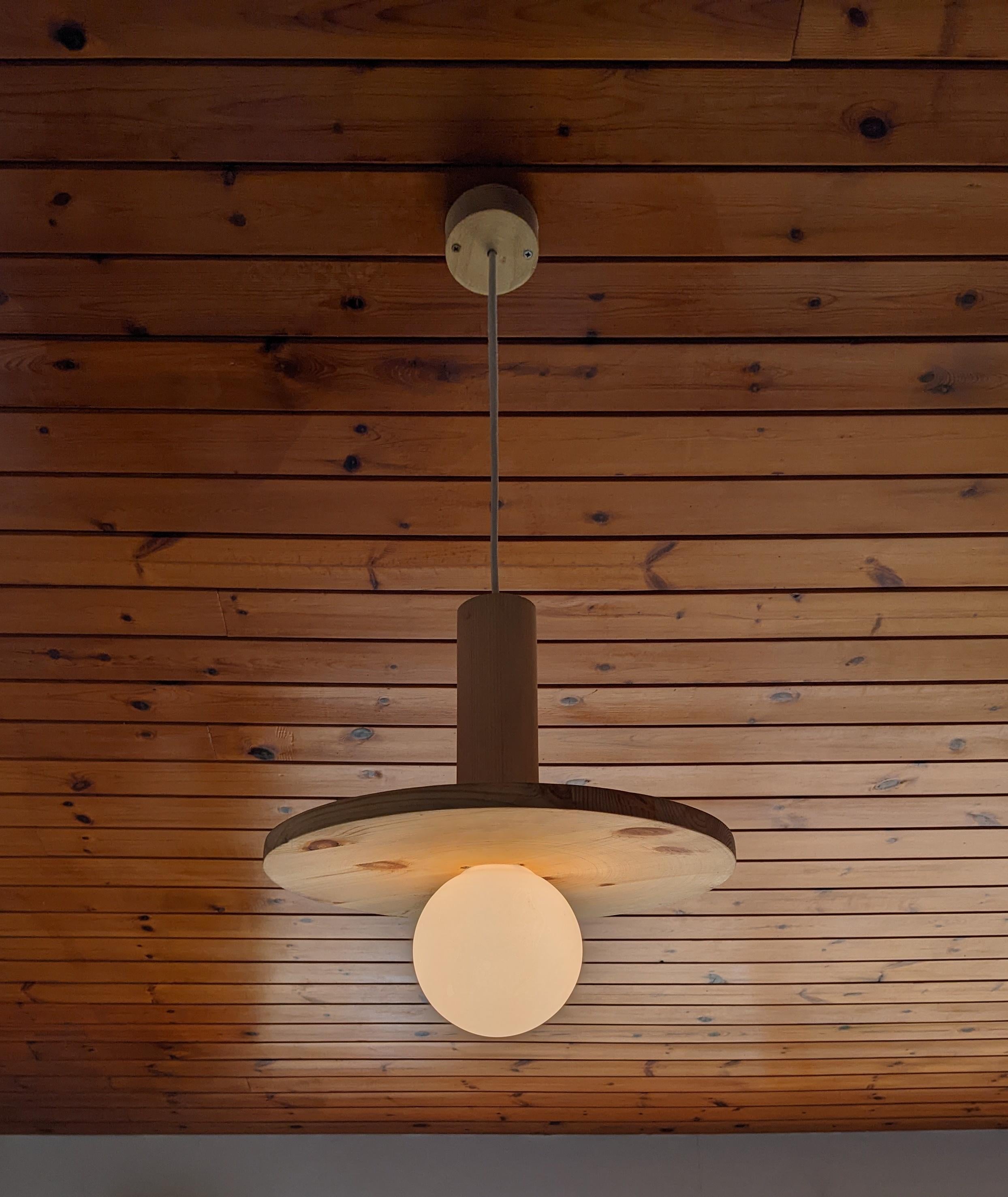 The Pistache is a versatile design that fits well in a group but really shines alone. It is made from sustainable pine so being a large light it is still lightweight. 

It comes with a dimmable bulb that can be warm, cool and mid colour tones and