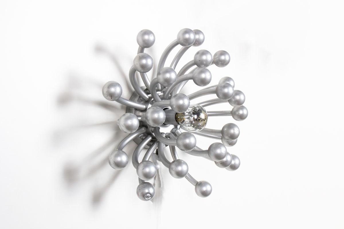 Pistillo model, famous design
Designed by Studio Tetrarch for Valenti Luce (signature on the back, see photo). 
Wall mount on which pistils are attached
All are made of chrome plastic
