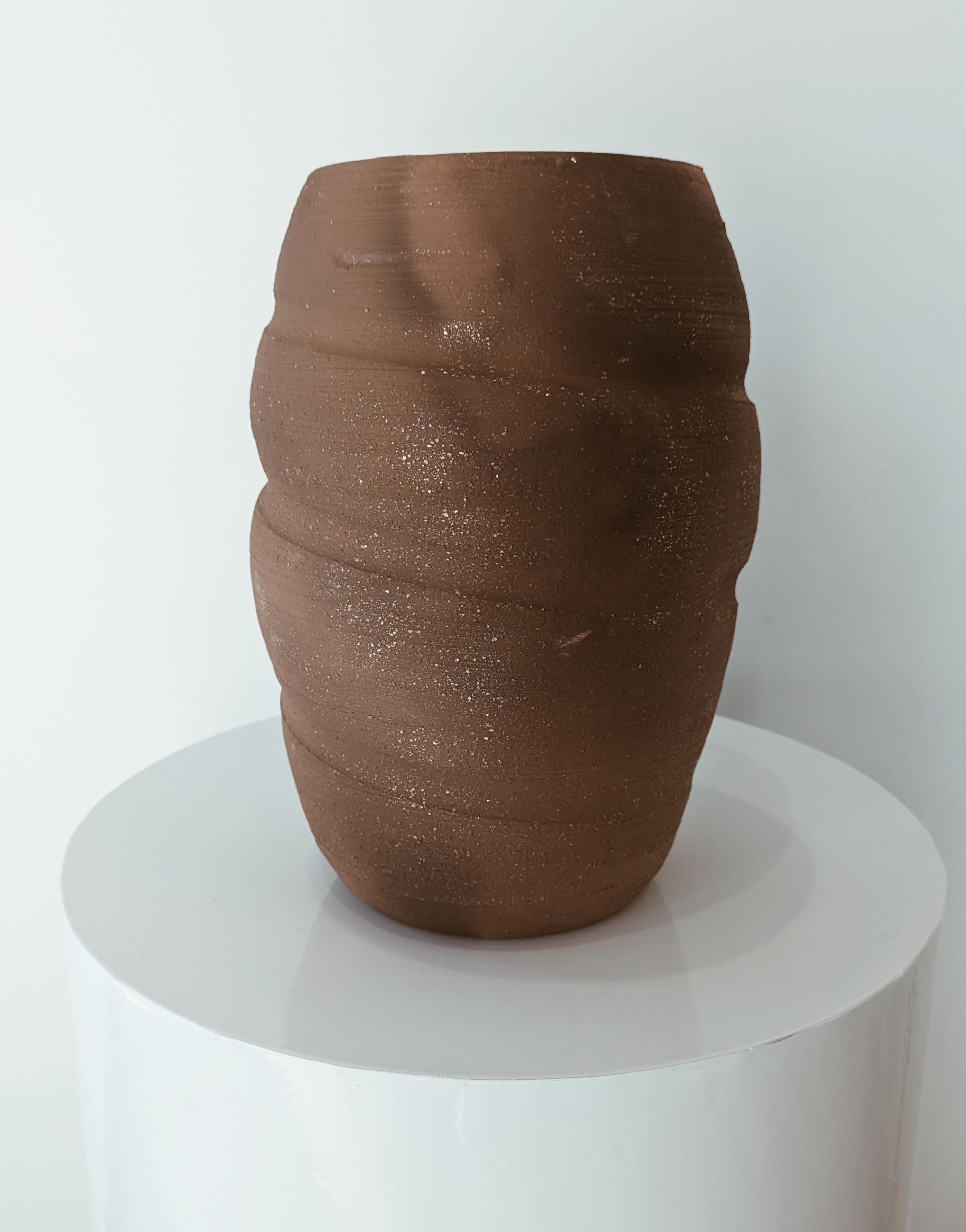 Inspired by the ancient art form of firing ceramics in a dirt pit, Erin Hupp’s latest collection of pit-fired ceramics is a once in a decade (or lifetime) body of work.

Each piece is hand thrown with a unique micaceous clay that can withstand the