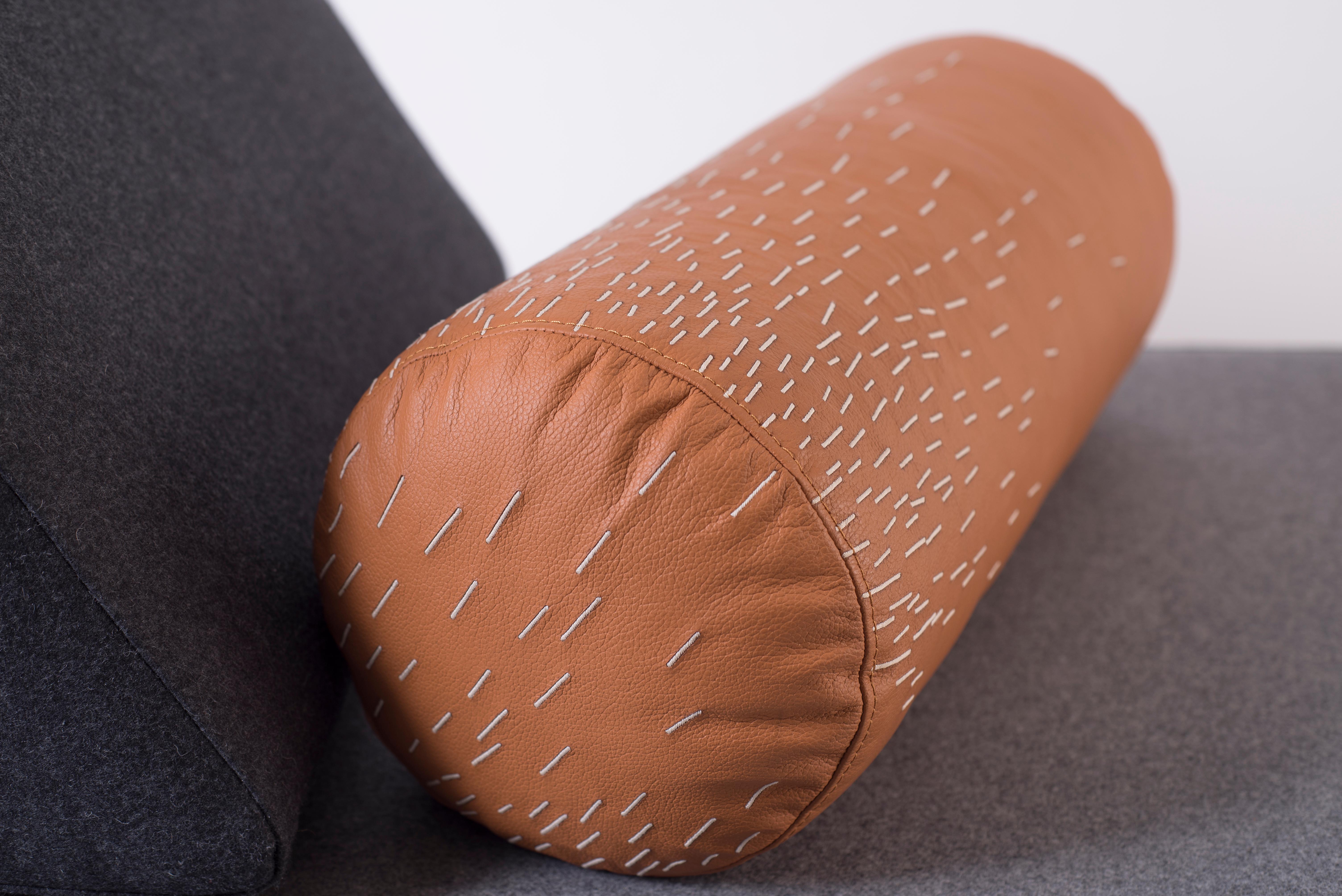 Pita’s name comes from piteado, the traditional embroidery technique used on the cylindrical leather cushion whose pattern resembles falling rain. Rest your head on this cushion and the rain will wash away the weight of your day.

Material: Cayenne