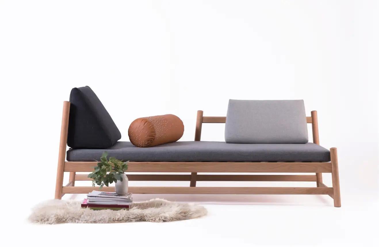 The Pita Daybed's subtle lines in turned oak invite you to recline, take a breath, close your eyes, and halt the passage of time. The name Pita comes from piteado, the traditional Oaxacan embroidery technique used on the cylindrical leather cushion