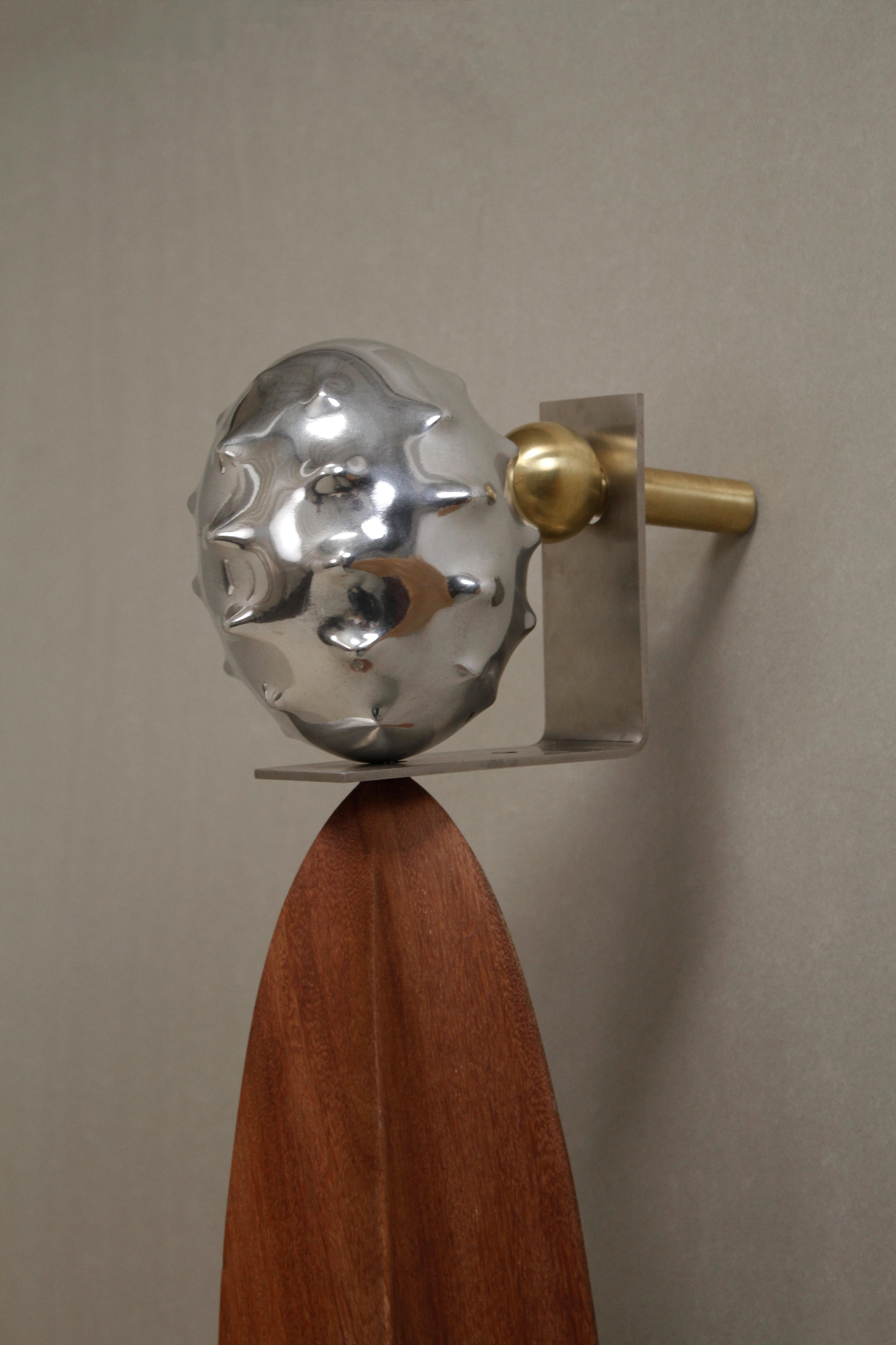 In the collection Delicadeza e Brutalidade, the sculptural furniture explores the essential duality between romance and violence, beauty and aggression. Materials such as marble, stainless steel, stone, and parchment embody these tensions — the