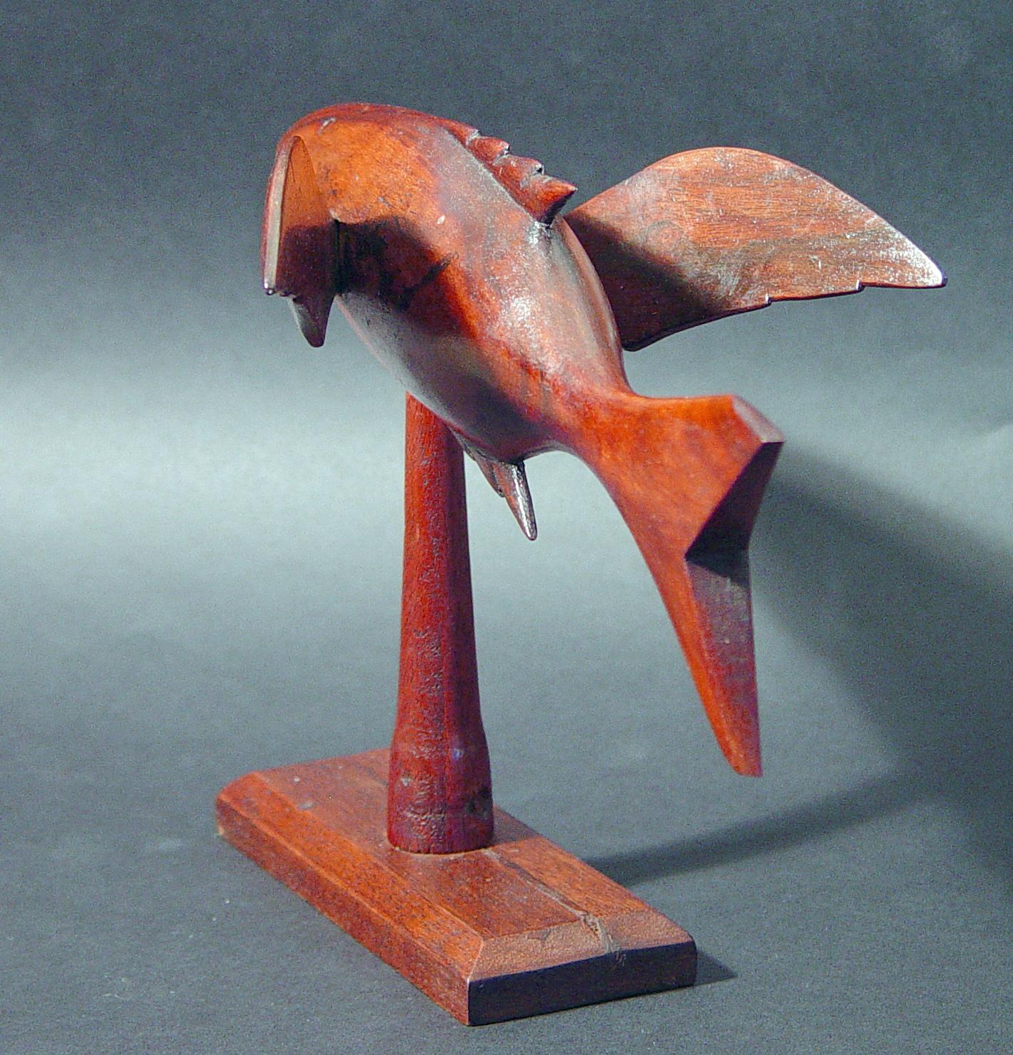 Pitcairn Island wood carving of a flying fish,
Miro wood, harvested on the coral atoll of Henderson Island,

The flying fish mounted on a wood base has an inscription 