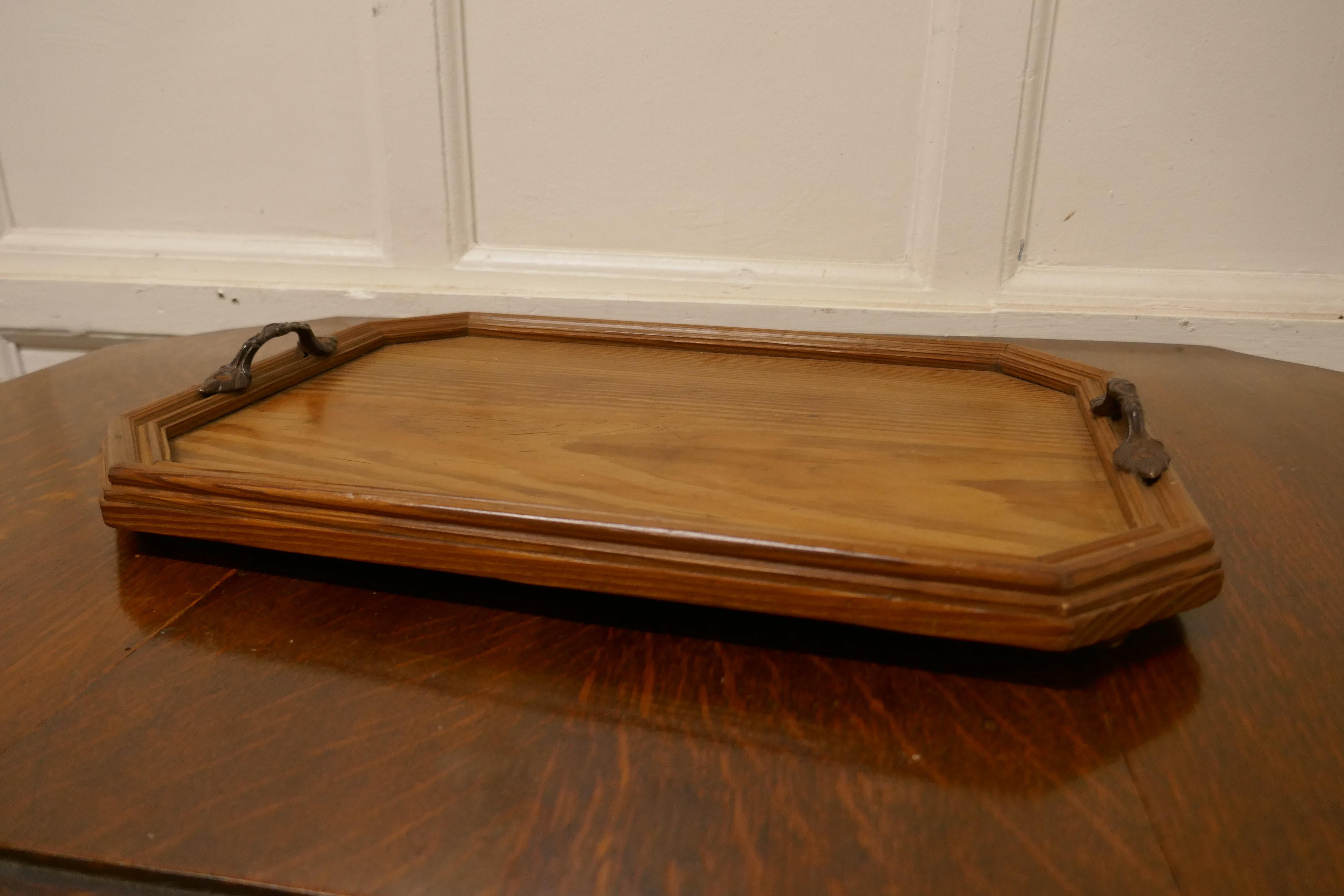 Pitch pine country tray

A good honest piece, the tray is made in pitch pine, it has a raised gallery, brass feet and carrying handles
A great piece in good condition 
The tray is 2” high, 17” long and 12” across
TGB709.