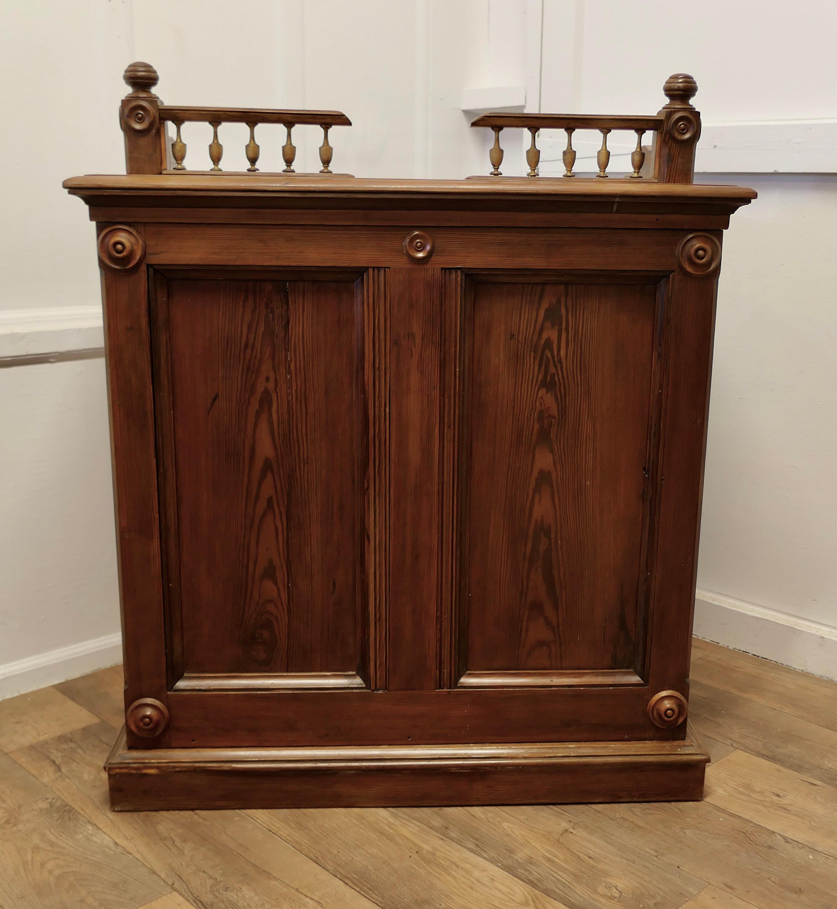 Pitch Pine Hotel Restaurant Reception Hostess Greeting Station, Greeter

A Good Heavy Pitch Pine Front of House Oak Greeter, the front and sides of the desk are panelled and decorated with roundels and the top has a decorative gallery
At the