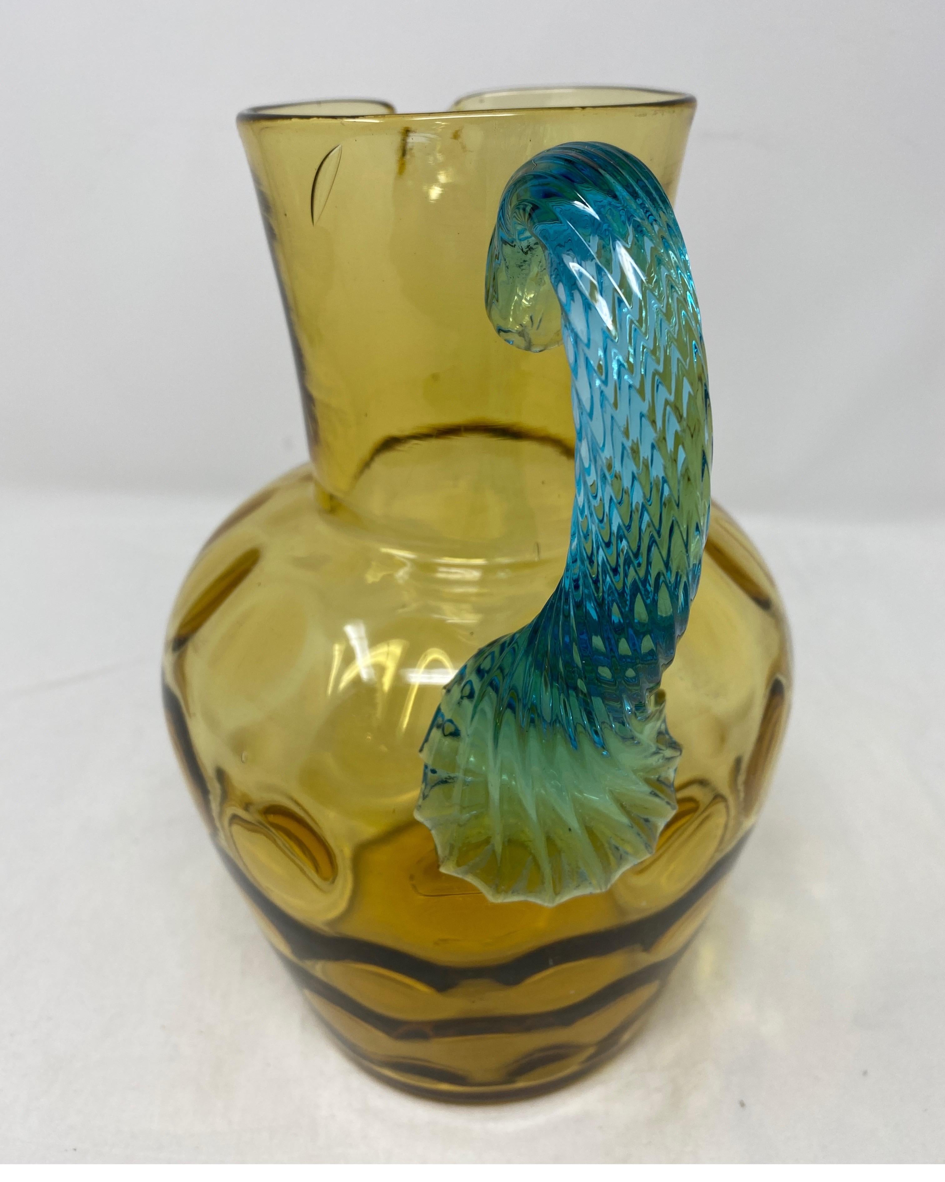 Pitcher George Sand. Amber glass pitcher and blue handle.