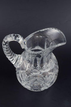 Pitcher in clear crystal glass with deep cut star and leaf patterns. 1930s/40s