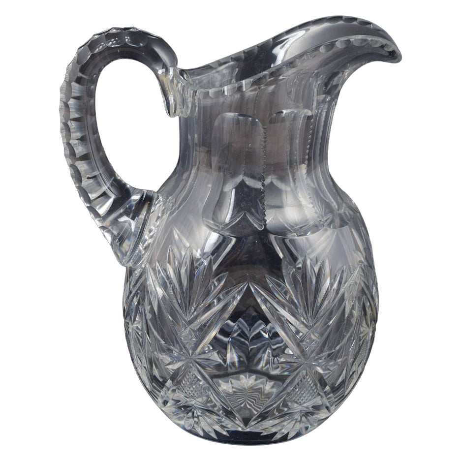 Pitcher in clear crystal glass with deep cut star and leaf patterns. 1930s/40s For Sale