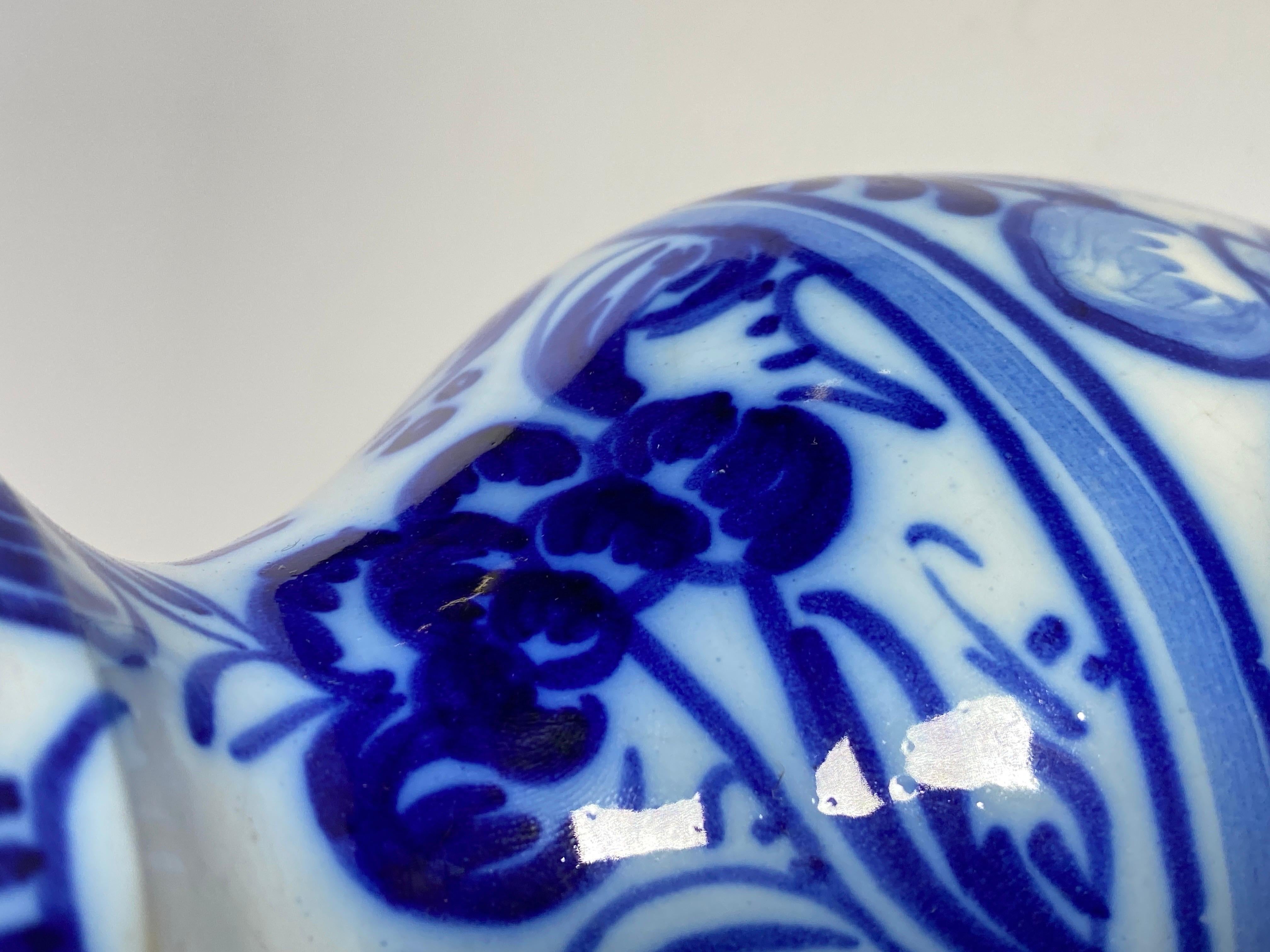 This Pitcher is in Faience, in a white and blue Color. It has been made in the Netherlands circa 1960.
  