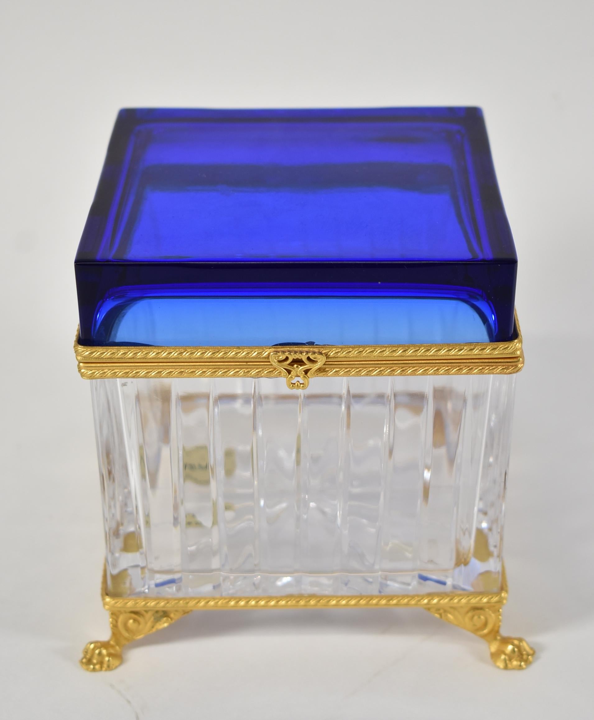 Cobalt blue and clear cut glass Italian Pitti Collection by Baldi lidded box. 24k gold dore frame and paw feet.