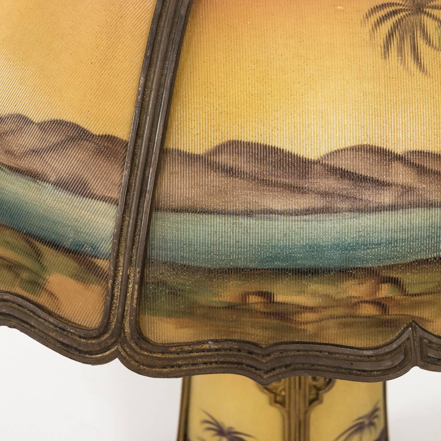 Six panel glass lamp with decorative desert scenes in an iron frame. This lamp lights up both on the top and bottom, circa 1915.
 