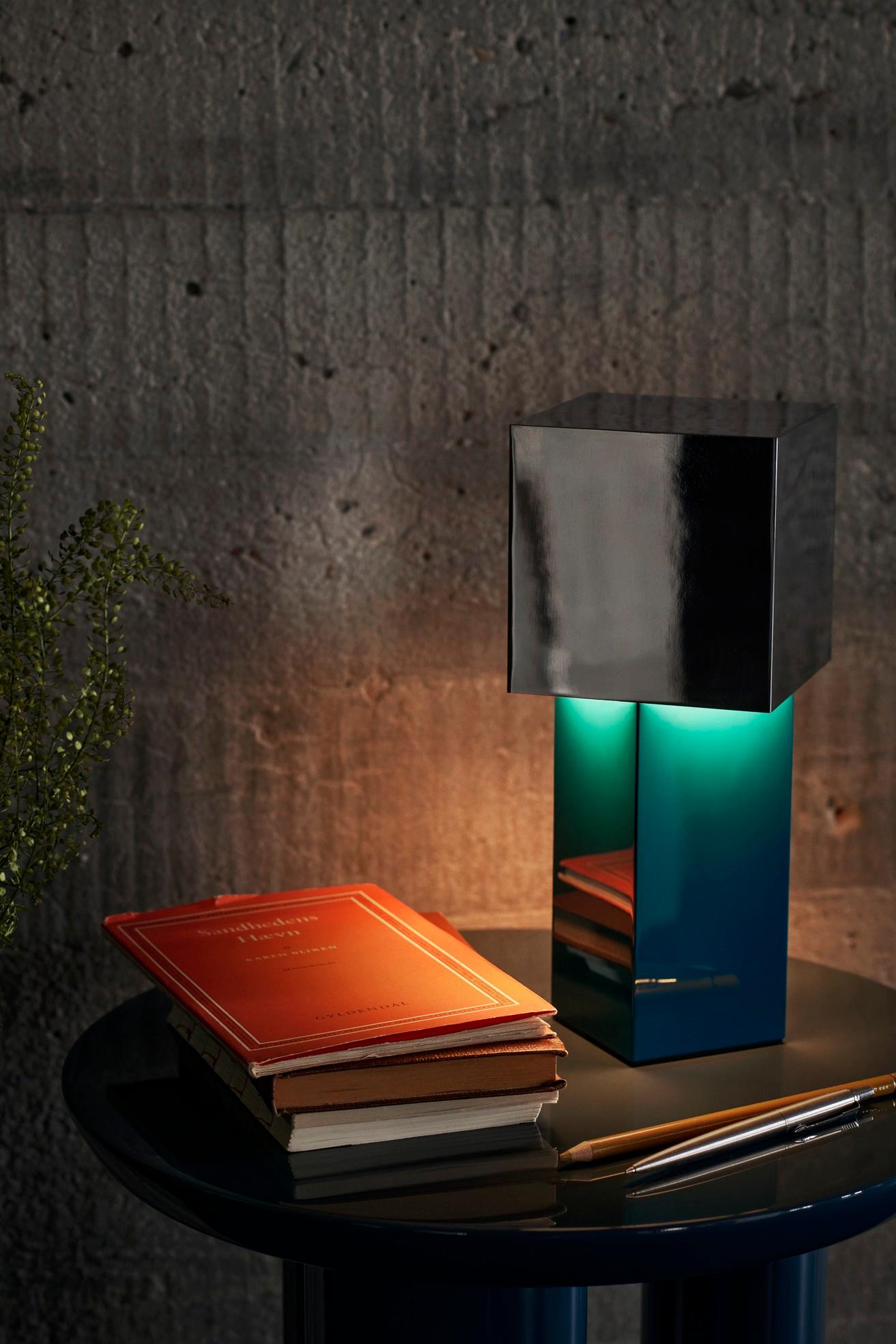 A portable lamp that explores the boundaries between form
and function
At the heart of Pivot’s design is the interplay between natural and manmade light. The lamp’s geometric shade is positioned at a 45-degree angle to the base, creating a soft