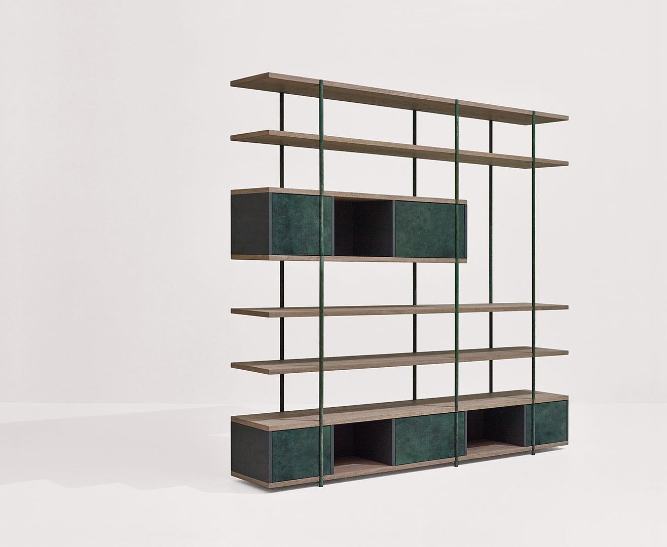 Pivot bookshelf by SEM
Dimensions: W216 x D38 x H203 cm
Material: metallic tubolar structure, pivoting doors in surface in antique brass or patinas, Shelves in fossil elm or Canaletto walnut, Side and back panels in matt
painted MDF. 
Available