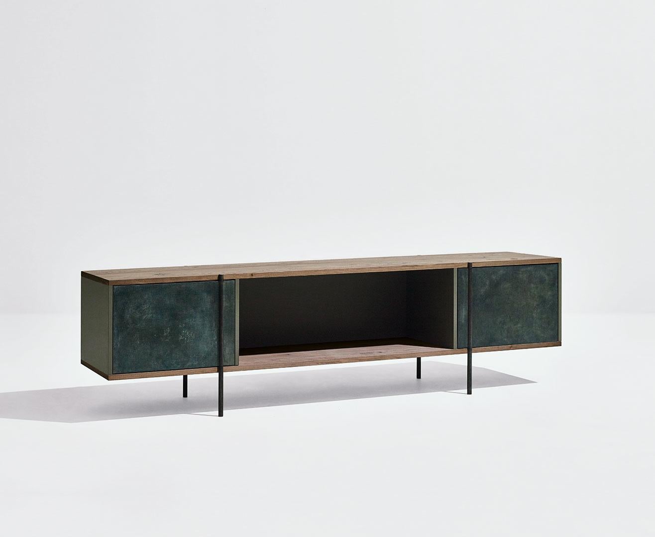 Pivot sideboard by SEM
Dimensions: W200 x D38 x H52.2 cm
Material: metallic tubolar structure, pivoting doors in surface in antique brass or patinas, Shelves in fossil elm or Canaletto walnut, Side and back panels in matt painted MDF.
Available