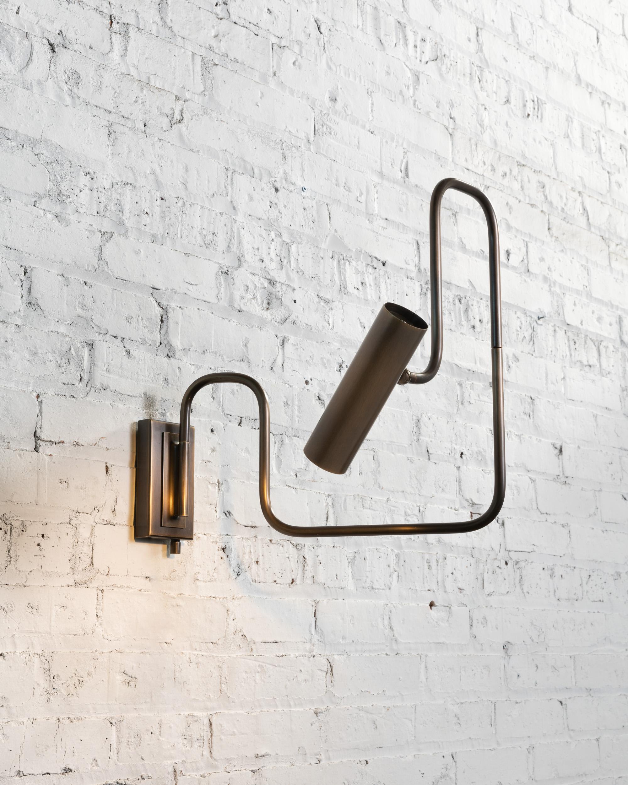 The Pivot LED series with its articulated arm and adjustable head this brass lamp, is not only multidimensional, but it is an ever changing line drawing that nestles into a room. Reminiscent of Industrial piping, the warmth of the refined material