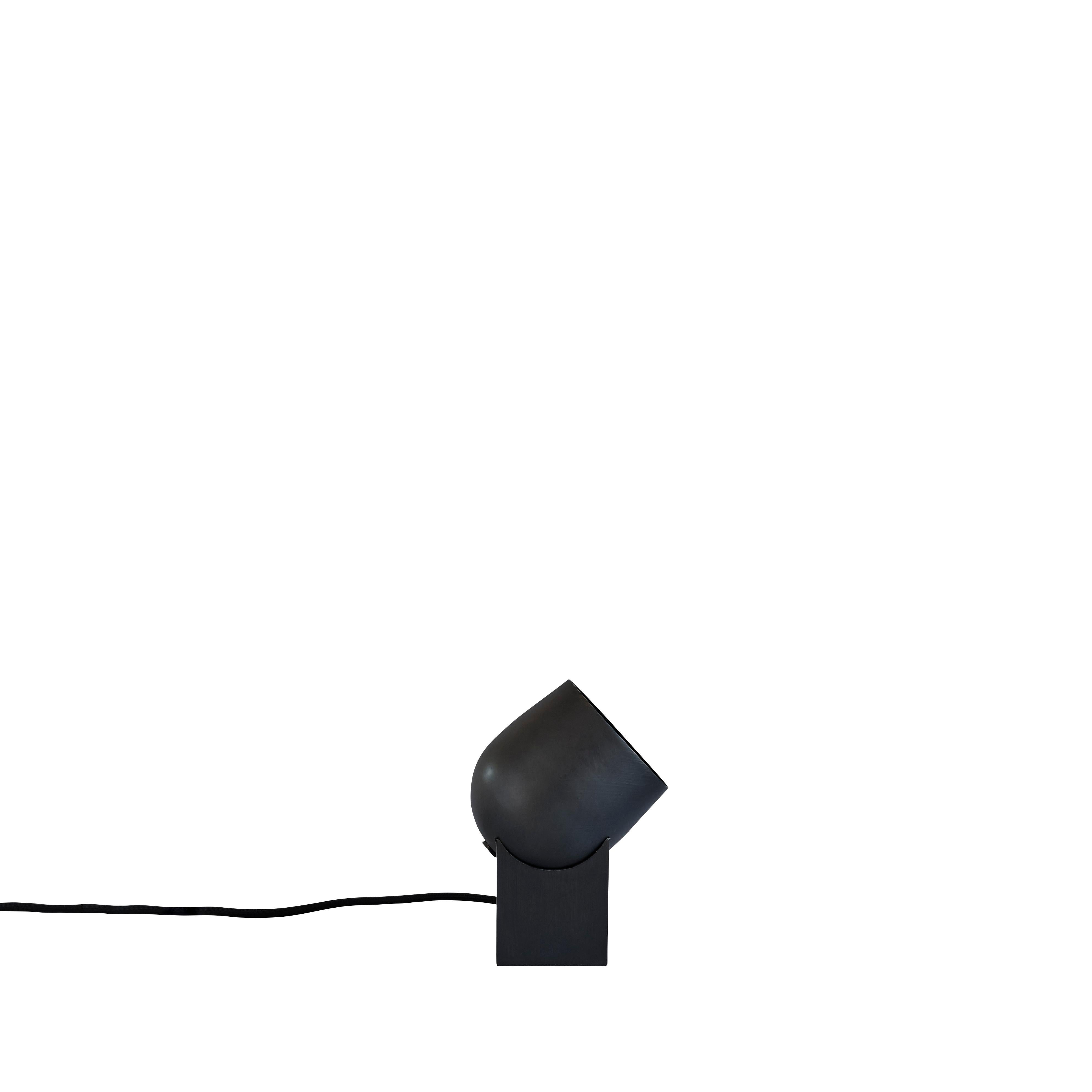 Pivot table lamp by 101 Copenhagen
Designed by Kristian Sofus Hansen & Tommy Hyldahl.
Dimensions: L 10,5 x W 10,5 x H 19 cm
Cable length: 190 CM

Materials: Metal: Plated metal / Burned black
Cable: Fabric covered cable with dimmer switch /