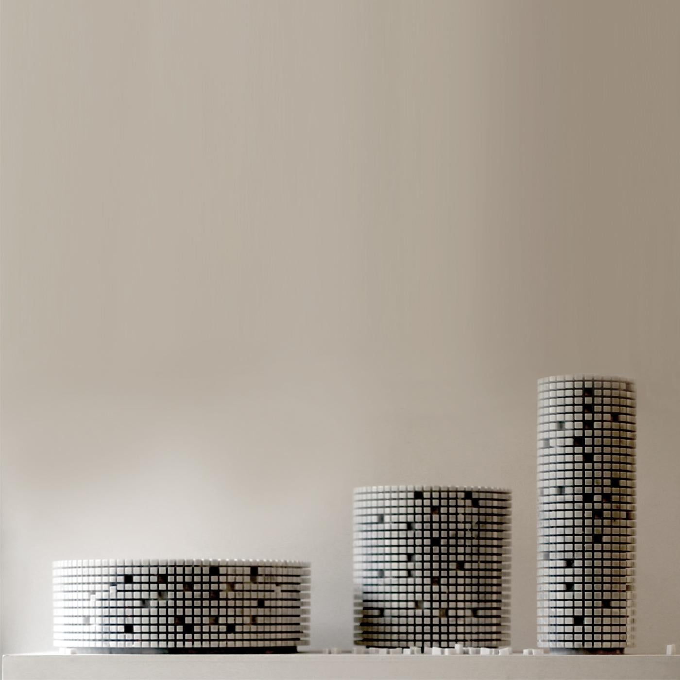The big low version of the Pixel design in white Carrara marble. Paolo Ulian used a single block to form the tall slim circular shape of the body and create the pixelated exterior that can be either kept or personalized by breaking off individual