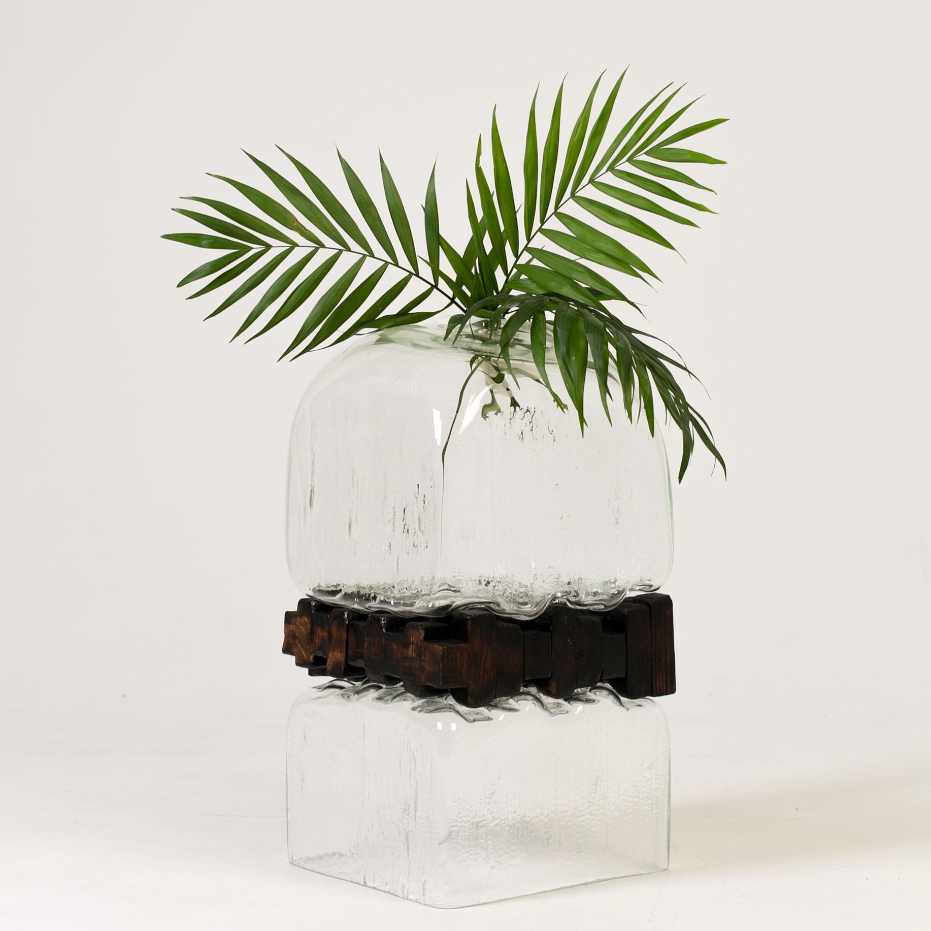 Pixel vase by Alexey Drozhdin
Dimensions: D 25 x W 25 x H 65 cm. 
Materials: Glass, Oak shape.

A young designer and artist Alexey Drozhdin creates extraordinary decorative glass objects. the designer became a finalist of the MilanoVetro-35