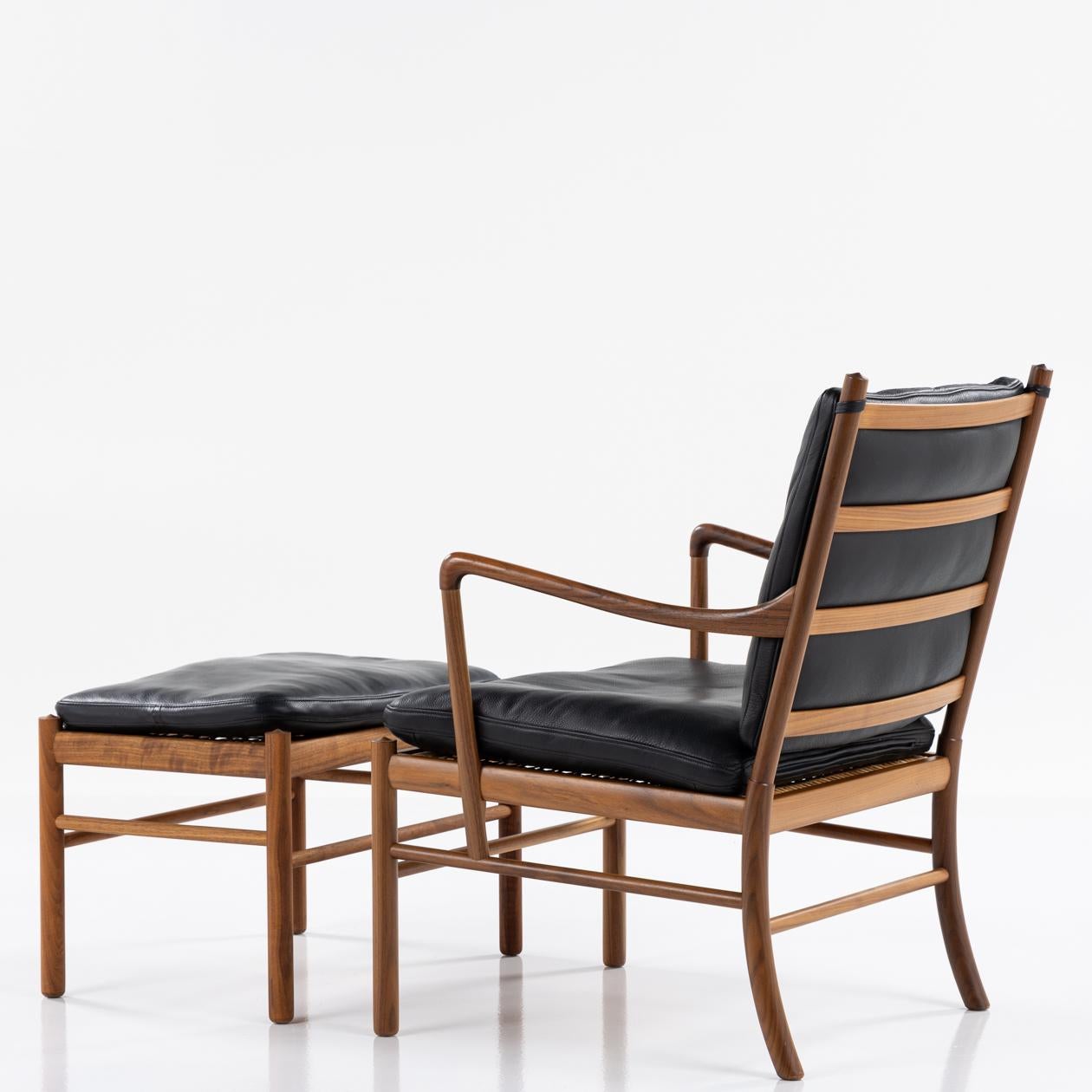 PJ 149 - 'Colonial Chair' in walnut and black leather with matching stool. By Ole Wanscher / P. J Furniture
