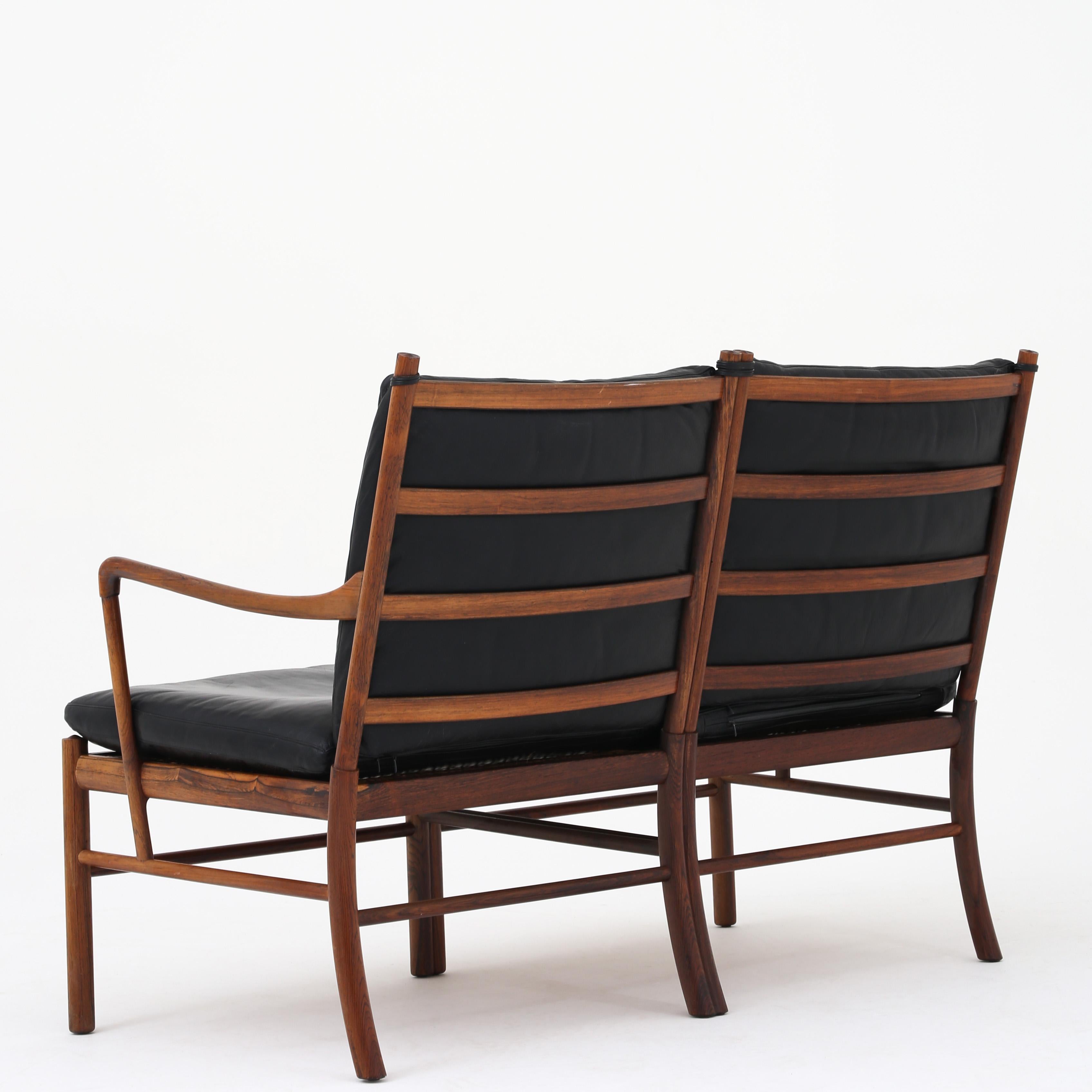 Ole Wanscher. PJ 149 - Canapé 2 places 'Coloni' en bois de rose avec coussins d'origine en cuir noir. Fabricant de meubles PJ.