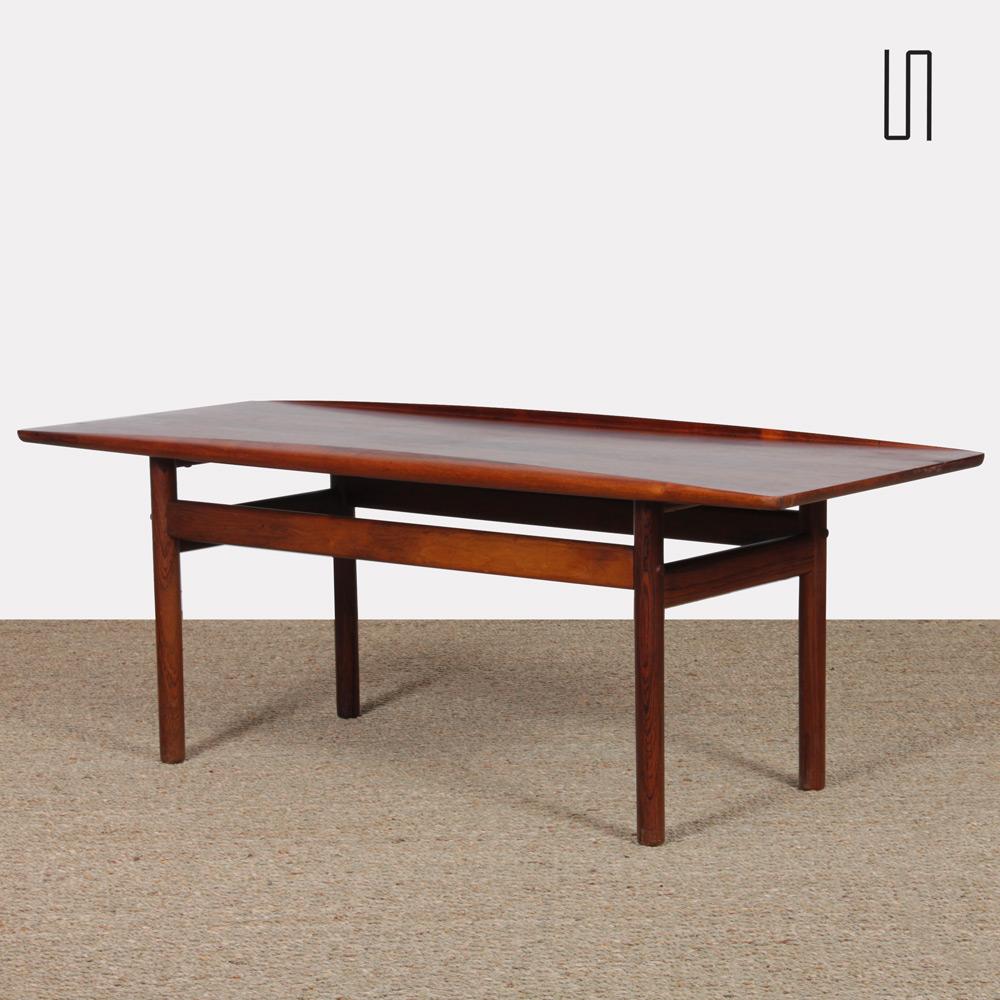 This Scandinavian coffee table, model PJ106 is in rosewood. It is in good condition. The top has been restored.