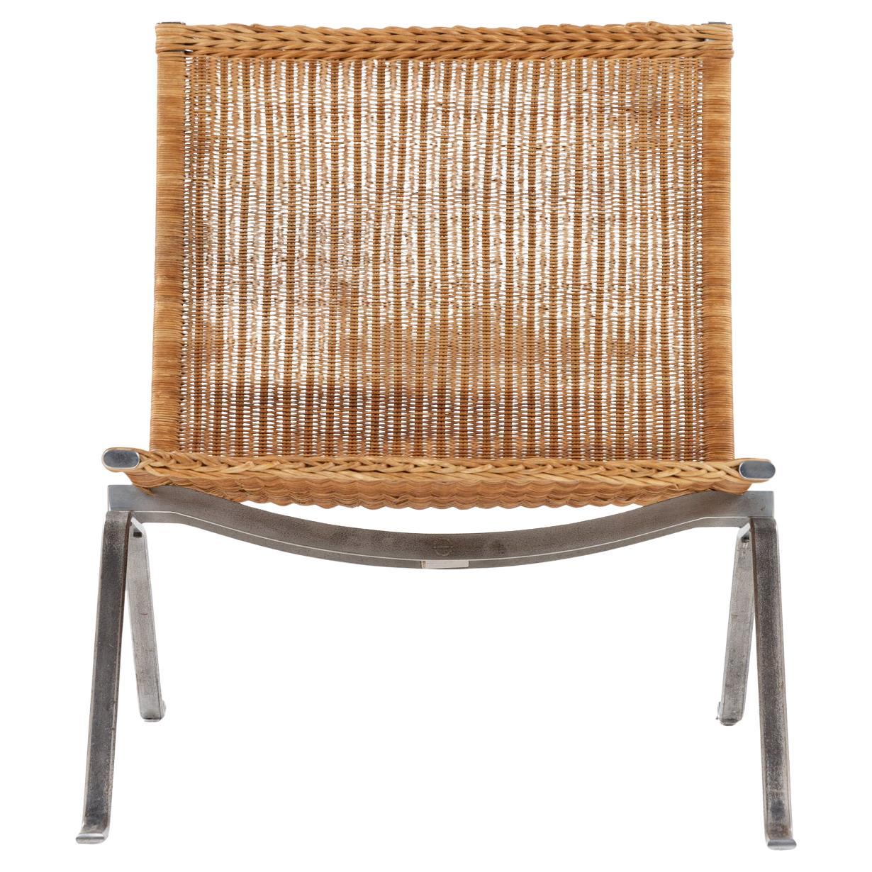 PK 22 - Easy chair in patinated woven cane by Poul Kjærholm For Sale