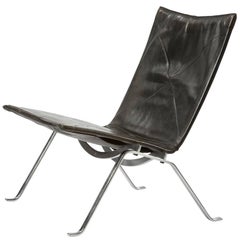PK 22 Lounge Chair in Spring Steel and Black Leather