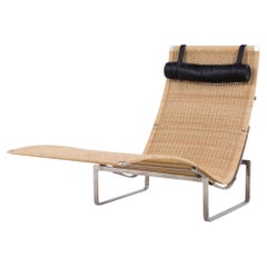 PK 24 - Chaise longue in wicker by Poul Kjærholm