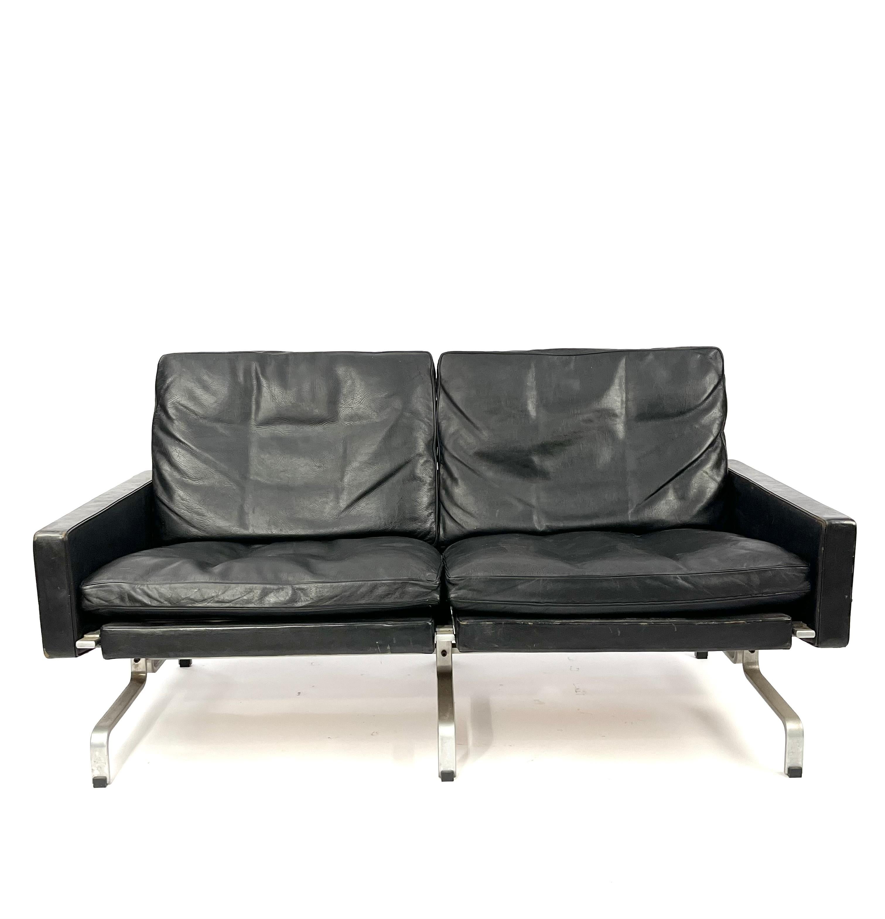 Poul Kjaerholm for E. Kold Christensen, two-seat sofa model PK 31, leather and metal, Denmark, 1960s.

Beautiful PK31 sofa in patinated black leather by Poul Kjaerholm for E. Kold Christensen. 
This sofa features Poul Kjaerholm’s ability to work