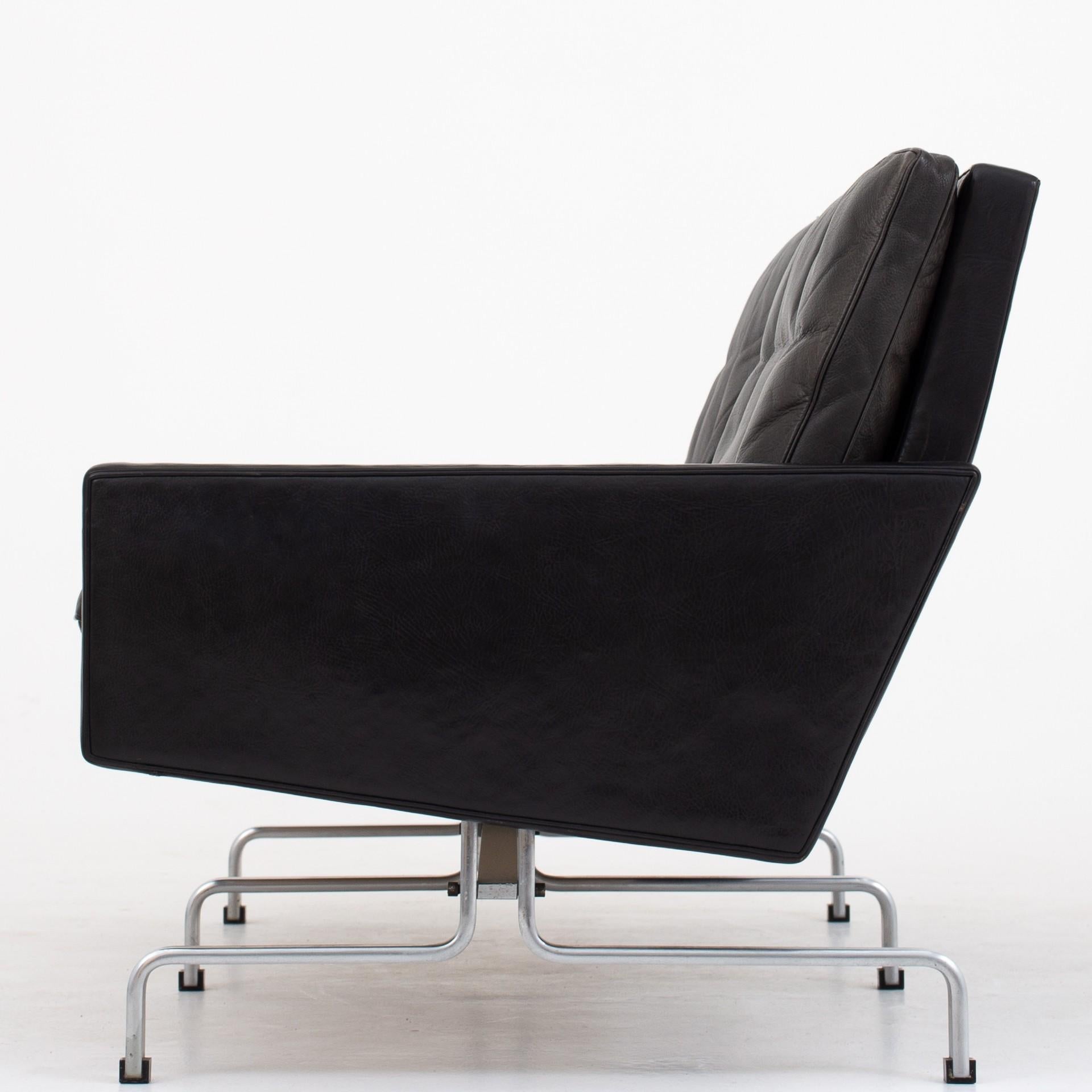 PK 31/2 – 2-seat sofa in patinated black leather on matt chromed steel frame. Two pieces in stock. Maker E. Kold Christensen. Design 1958.