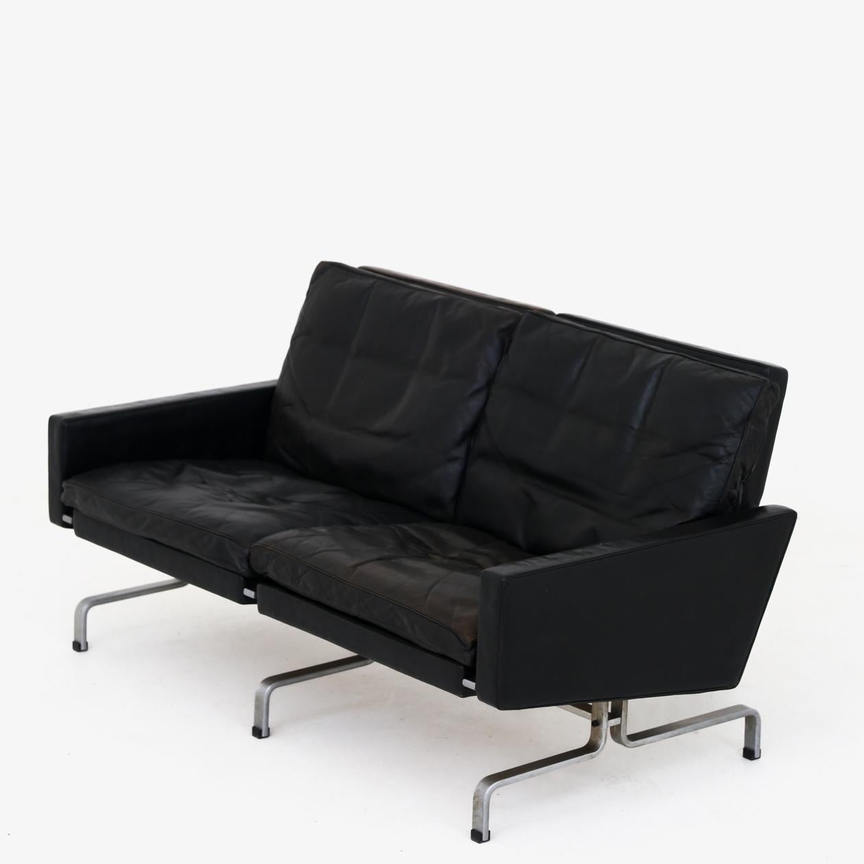 PK 31/2 - 2-seater sofa in original patinated black leather on matt chromed steel frame. Poul Kjærholm / E. Kold Christensen.