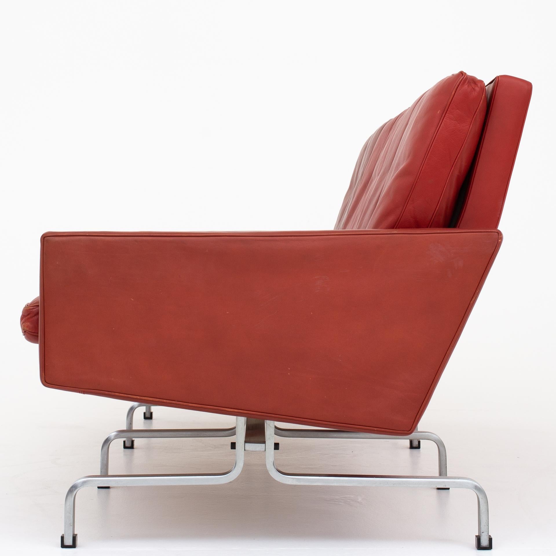 PK 31/3 – 3-seat sofa in red black leather on matt chromed steel frame. Maker E. Kold Christensen.