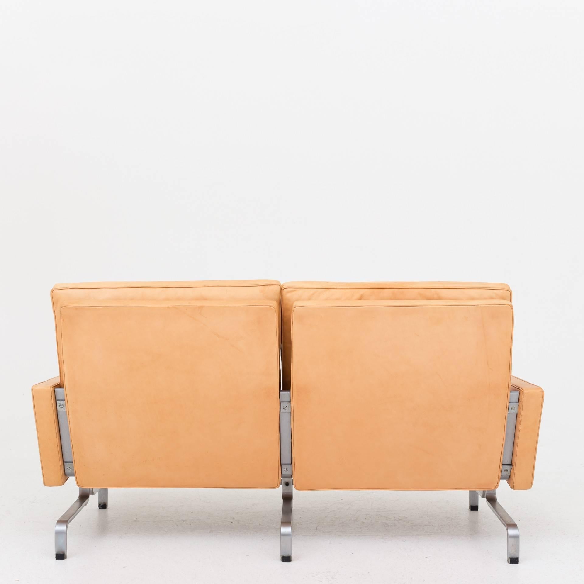PK 31/2, two-seat sofa in natural leather and frame in chromed steel. Maker E. Kold Christensen.