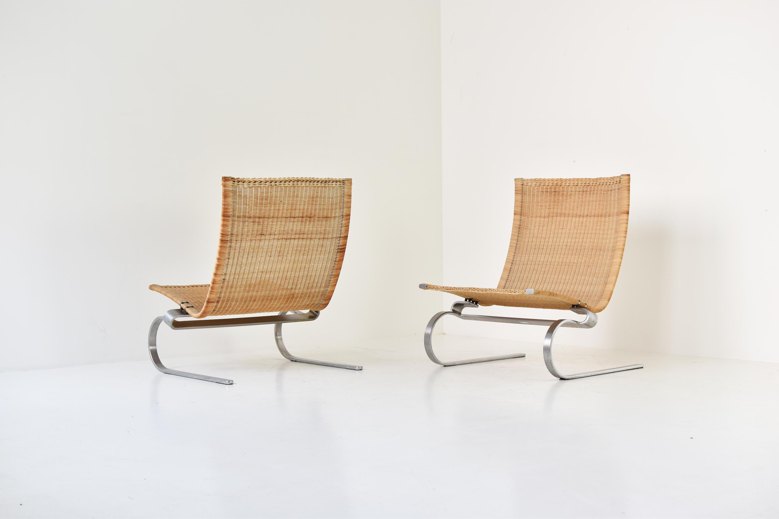 Set of two ‘PK20’ easy chairs designed by Poul Kjaerholm for Fritz Hansen, Denmark 1994. These easy chairs features a hand-woven rattan seat and a matte chromed flat steel base. Very good condition with some minor wear. Labeled underneath with the