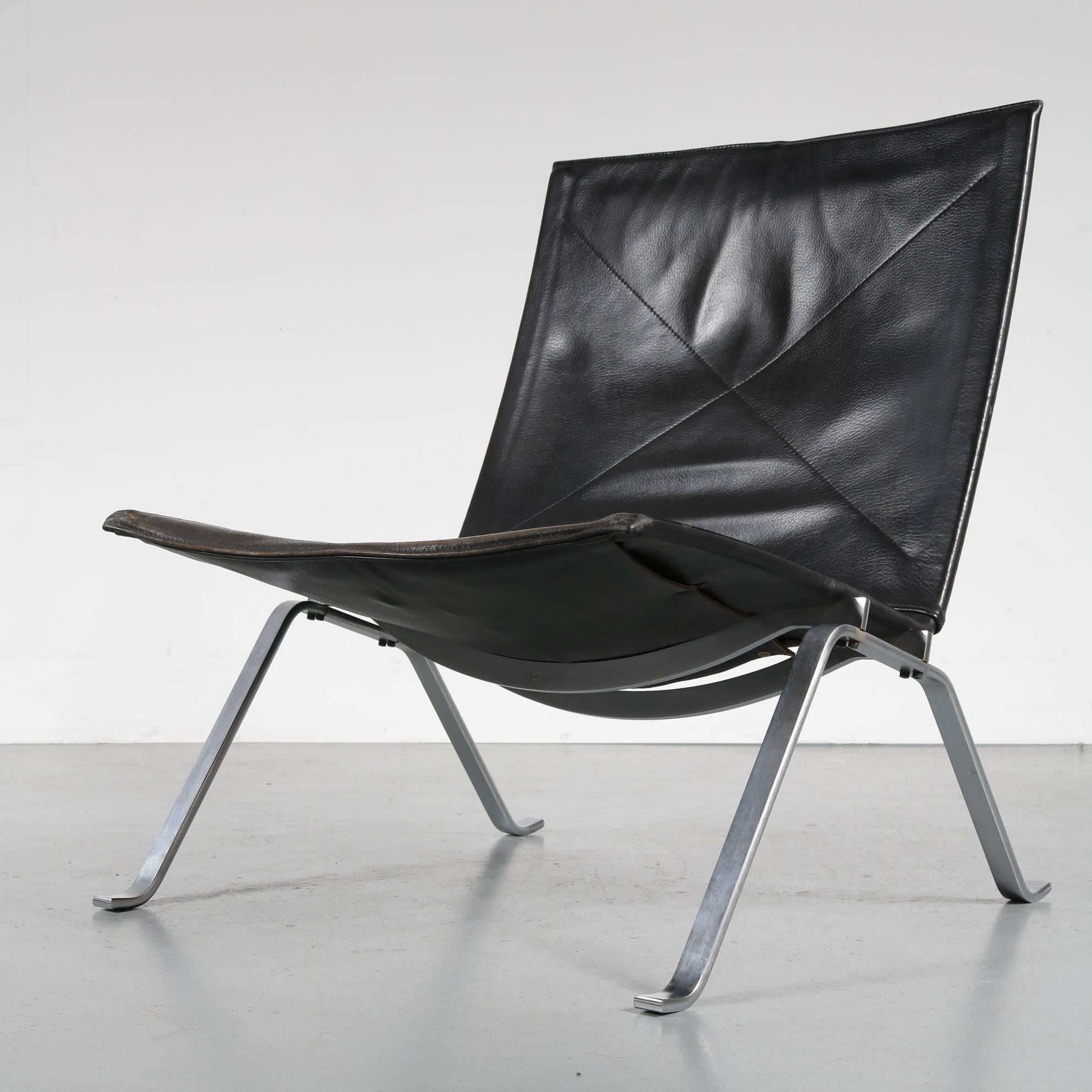 A stunning PK22 lounge chair, designed by Poul Kjaerholm, manufactured by E. Kold Christensen in Denmark, circa 1960.

The chair has a beautiful chrome-plated metal base. It is upholstered in high quality thick black leather. This use of materials