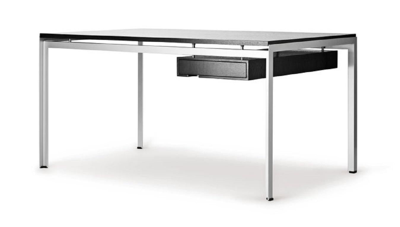 The PK52A student desk was designed by Poul KjÃ¦rholm for the Royal Danish Academy of Fine Arts, while he was a member of the academic staff. The cleverly constructed table highlights KjÃ¦rholmâ€™s signature ability to unite traditional