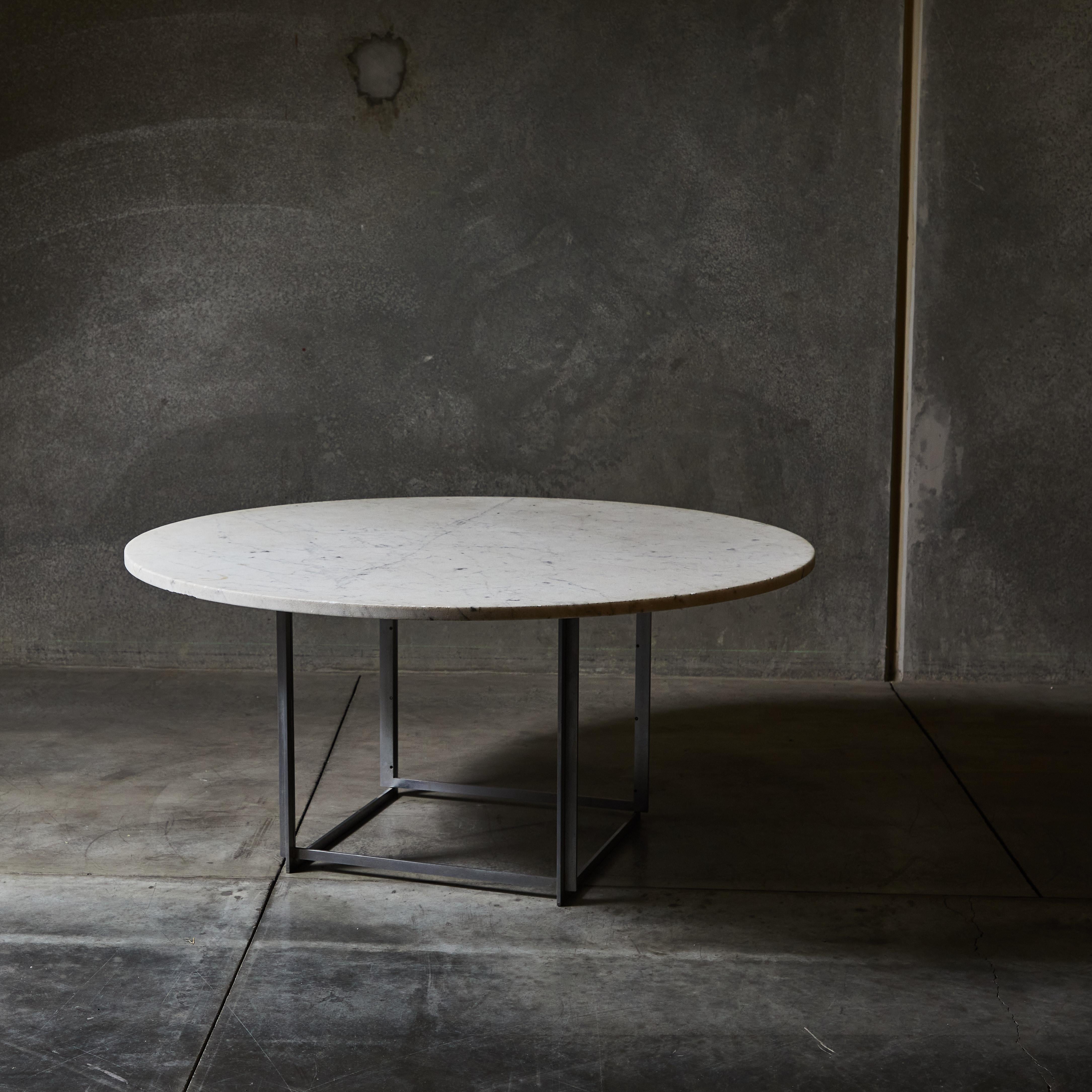 PK54 marble and steel dining table by Poul Kjærholm. Produced by E. Kold Christensen. Made in Denmark, circa 1963.

Materials: flint-rolled Italian marble and matte chrome-plated steel.

Literature: The Furniture of Poul Kjaerholm: Catalogue