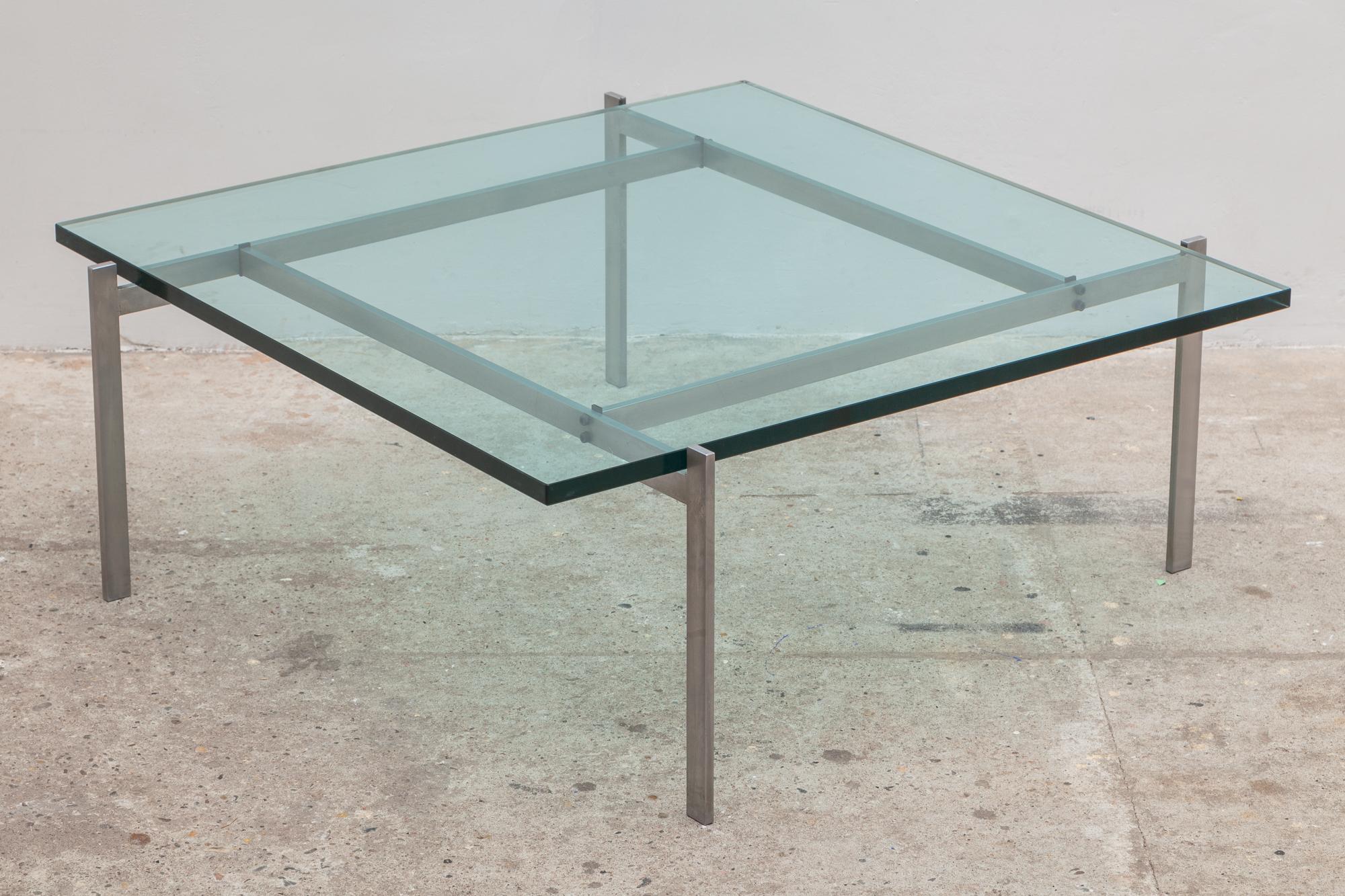 PK 61 coffee table by Poul Kjaerholm, Denmark. Designed in 1956 and produced by E. Kold Christensen. Sleek steel frame with offset legs supports a sheet of pool-blue glass. Stamped with the EKC Denmark logo. Original good condition.
Dimensions: 83 W