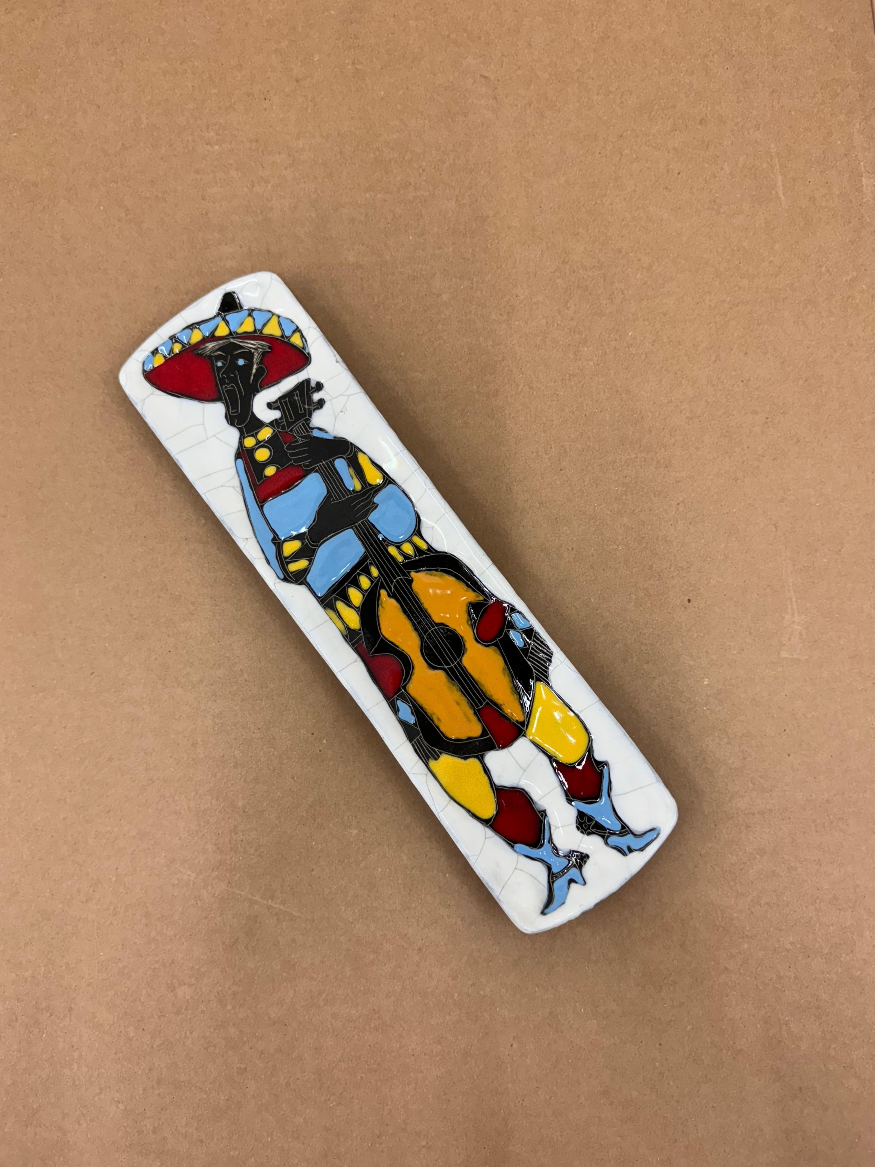 Beautiful polychrome ceramic bas-relief, depicts a guitar player Designed by Bruno Hugo for Arces pottery - Republic of San Marino, indicatively in the 1950s.
Can be used as a countertop plate or wall plate.
In very good condition, light and normal